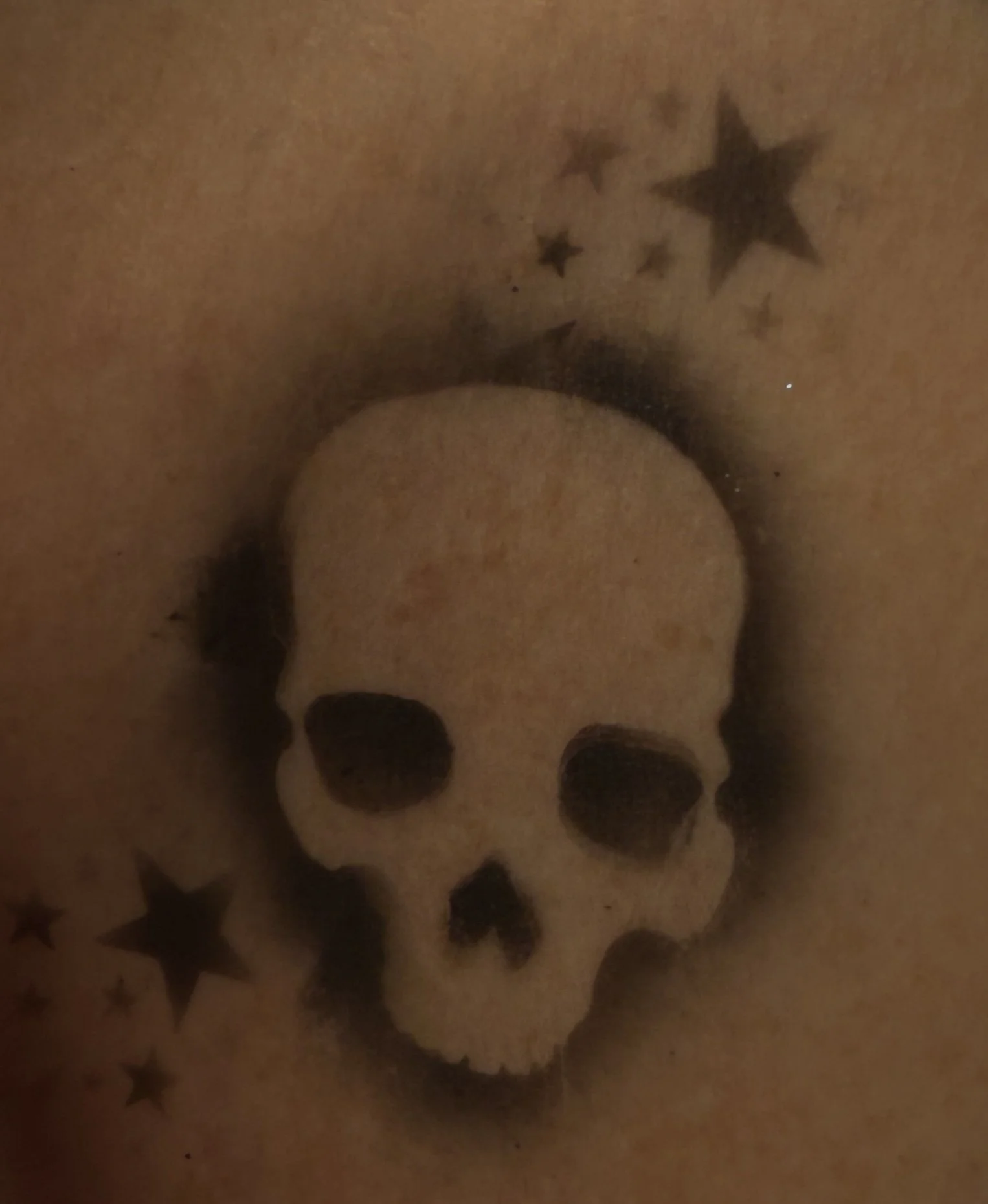 skull + stars airbrush tattoo