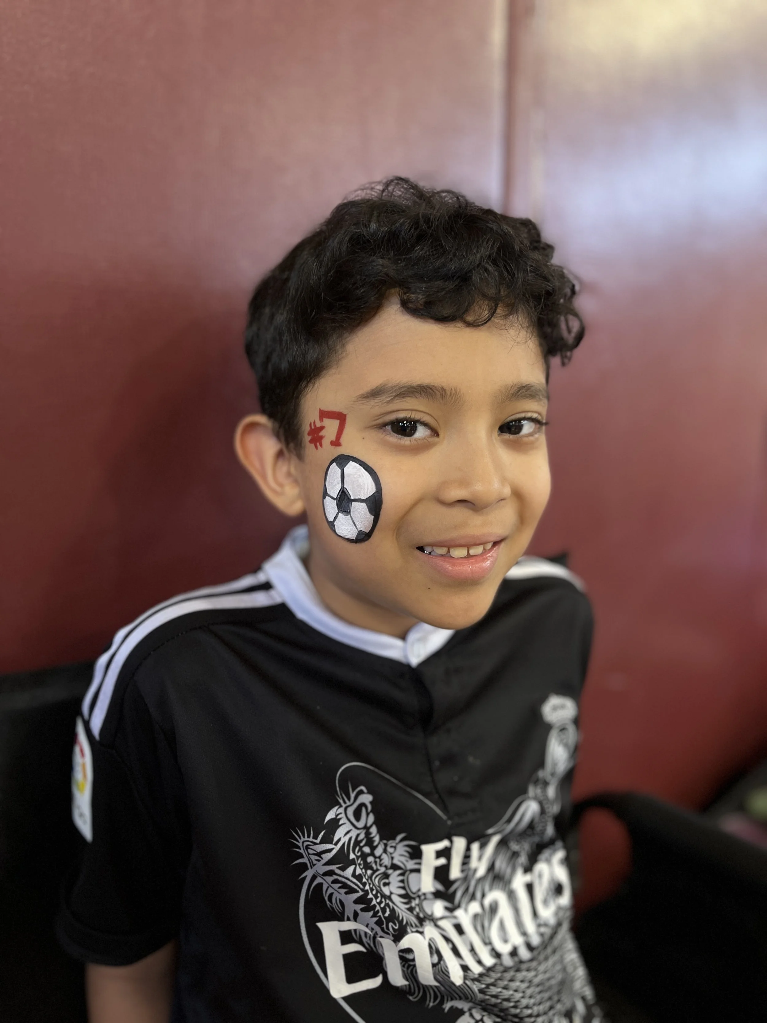 soccer ball with team # face paint