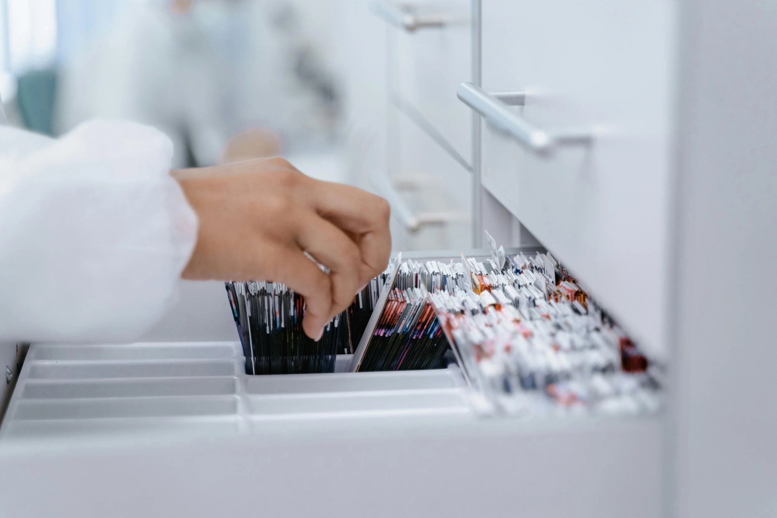 A scientist search for record in the cabinet