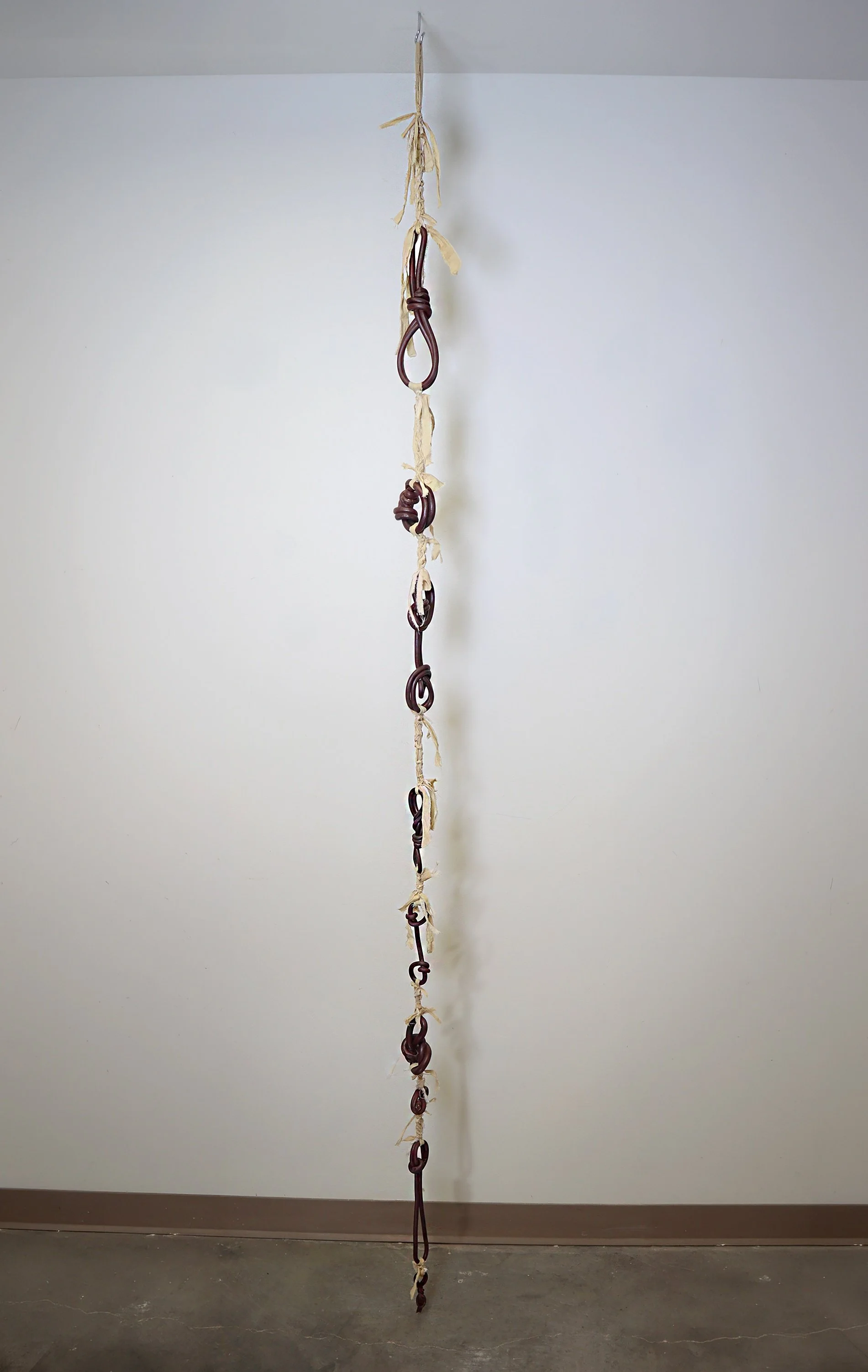 Vanessa Romo, Meditatons On Grief, Ceramic, Iron, Muslin, Coffee, 5 x 96 x 12 inches, 2026, NFS