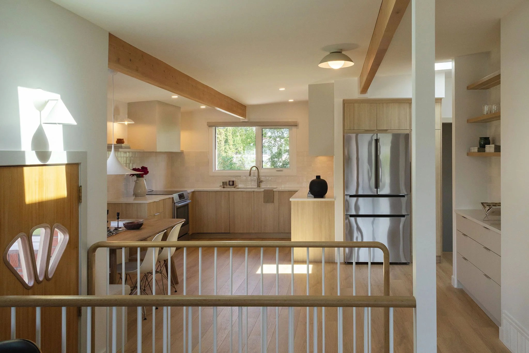 Bright open-concept kitchen in a renovated Edmonton mid-century bungalow.