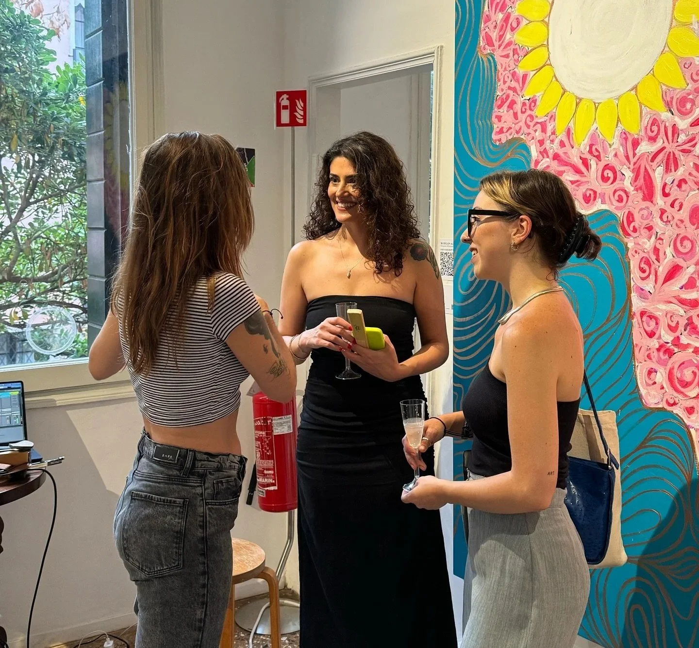 Morgan Allis speaking with guests at her art exhibition
