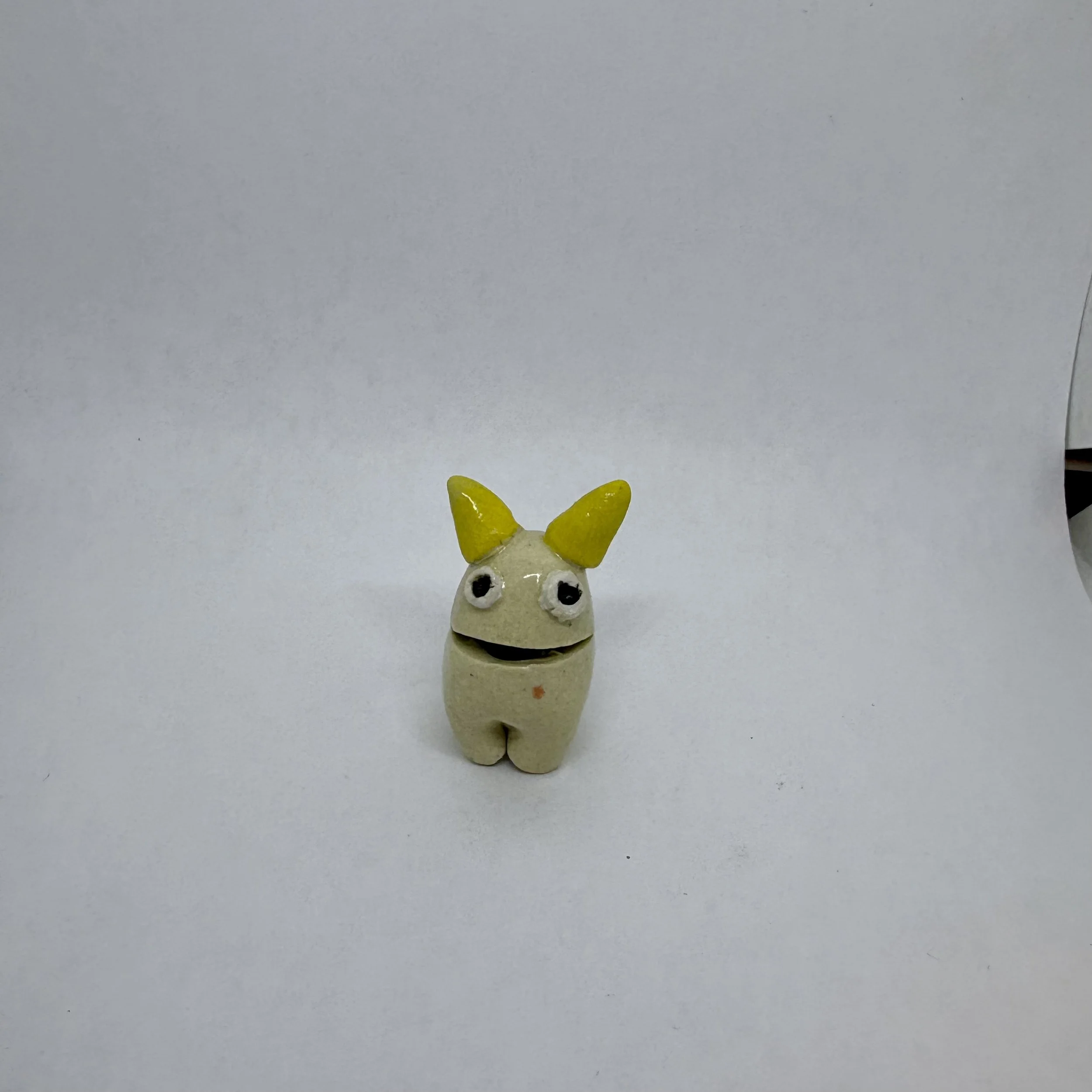 Tiny monster - white with yellow horns