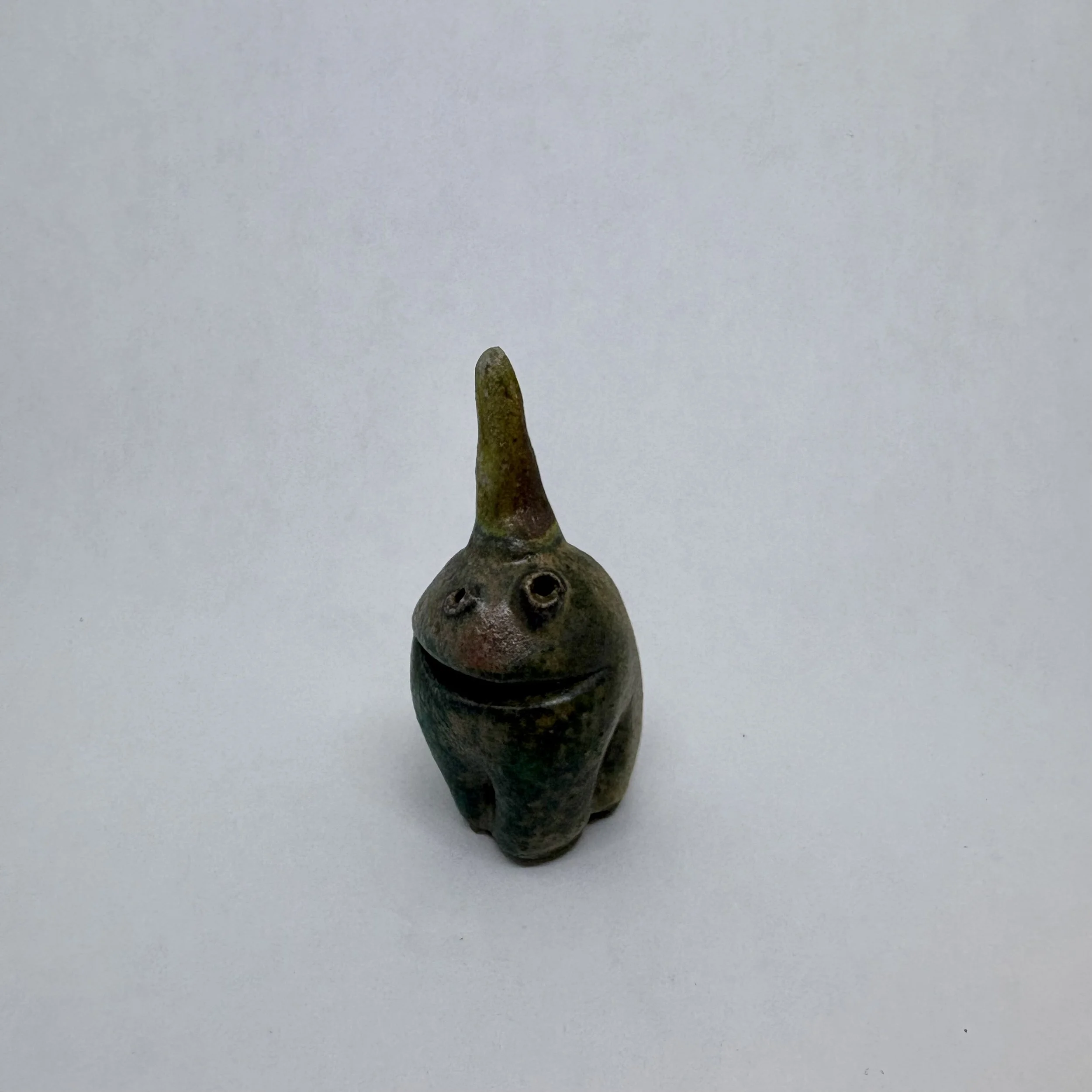 Tiny monster - soda fired varigated color with single horn
