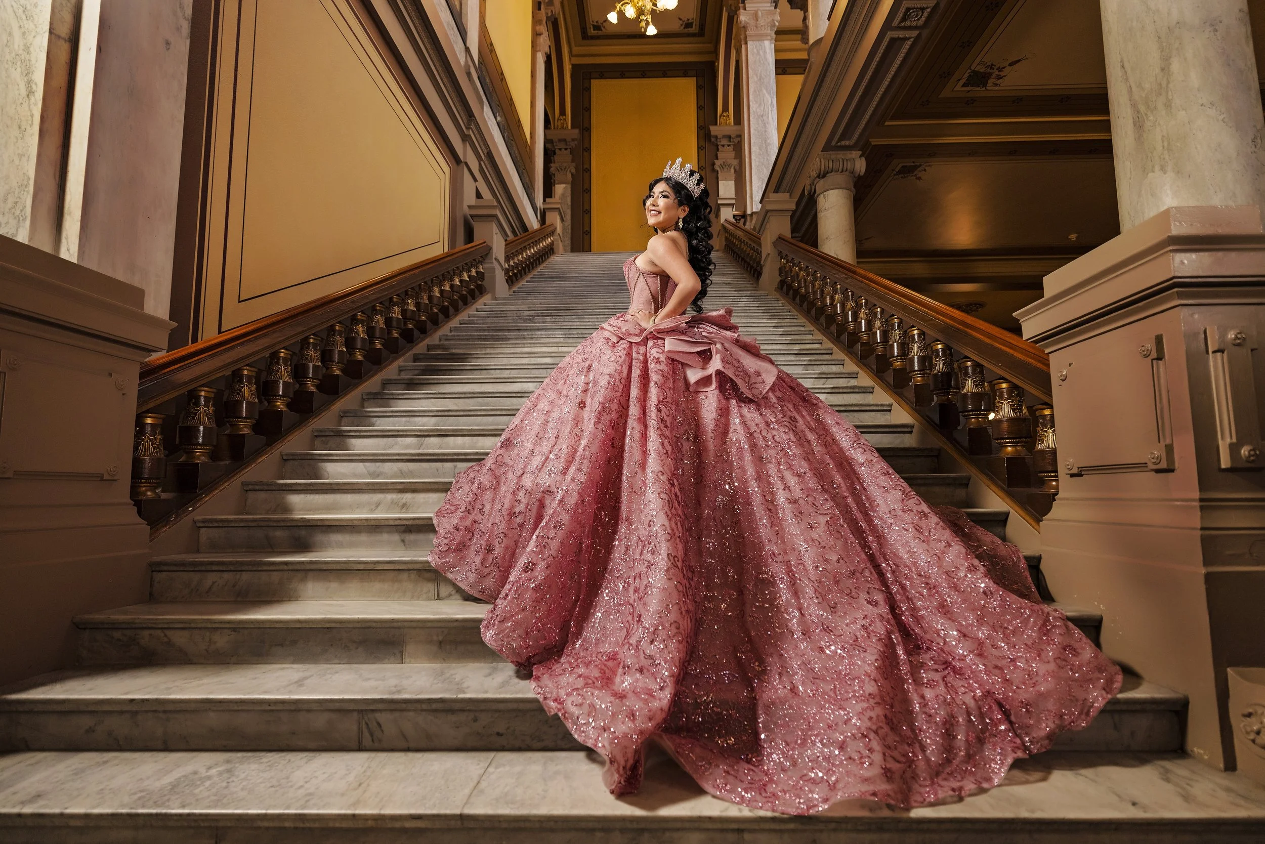 Indoor quinceañera session on grand staircase with pink ball gown – luxury Sweet 15 photography by Eli Mestas in Indianapolis
