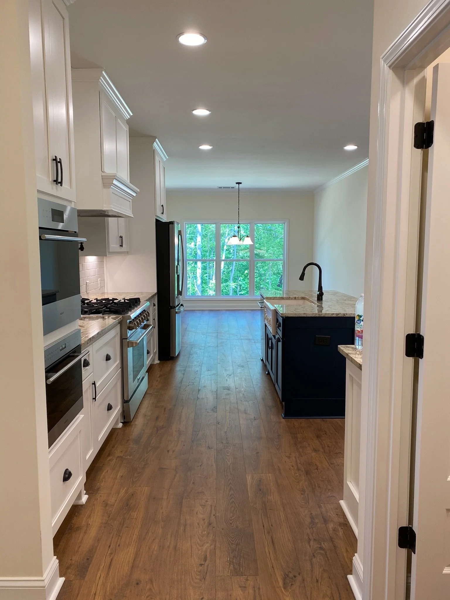 Upgraded LVP flooring creates warmth and functionality, while 10-foot ceilings provide openness to the space.