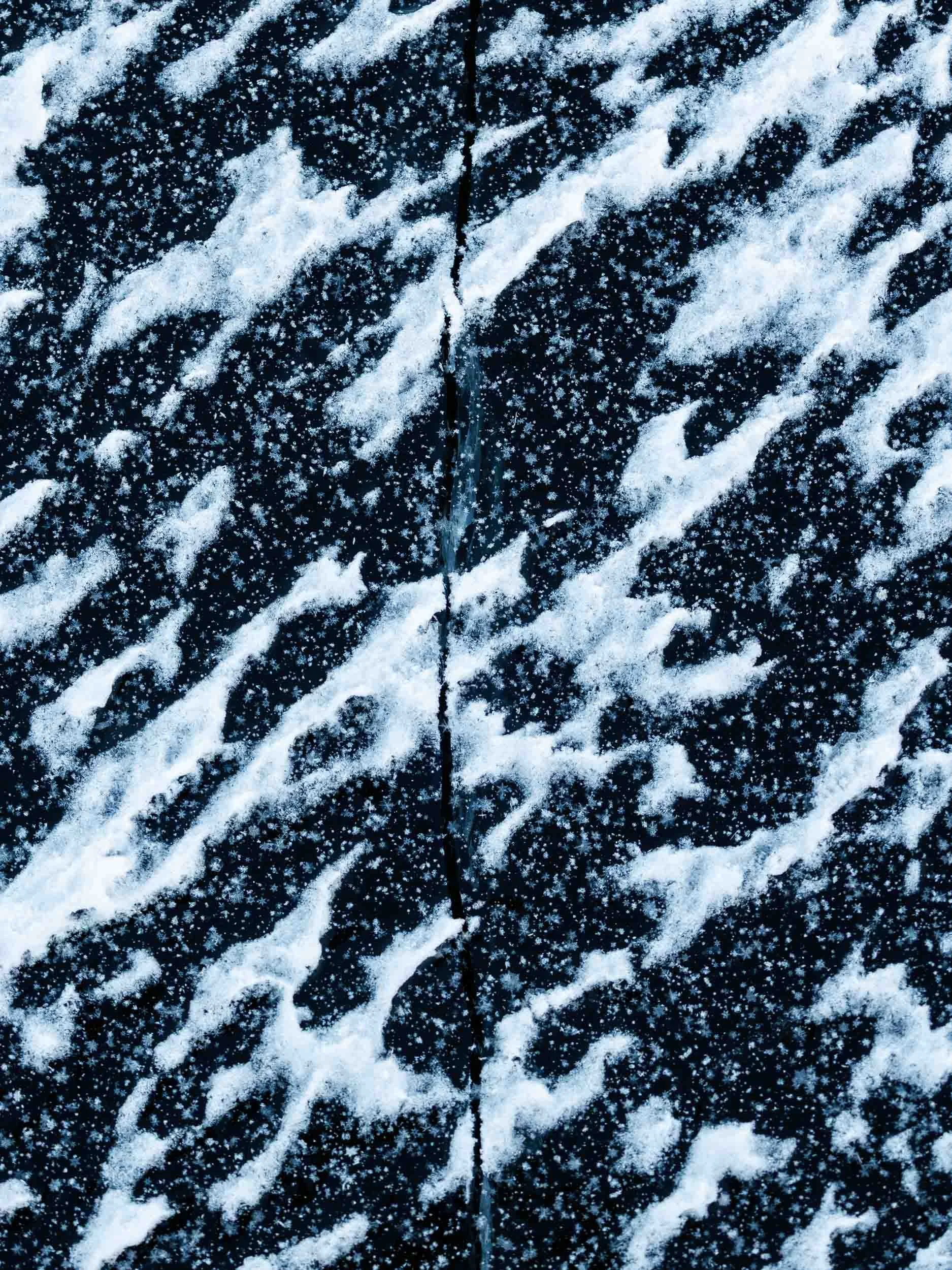 Abstract patterns created by the wind on the surface of the torneträsk lake
