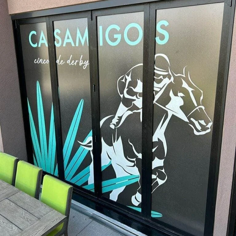 Casamigos artwork adapted to window installation for Cinco de Derby activation.