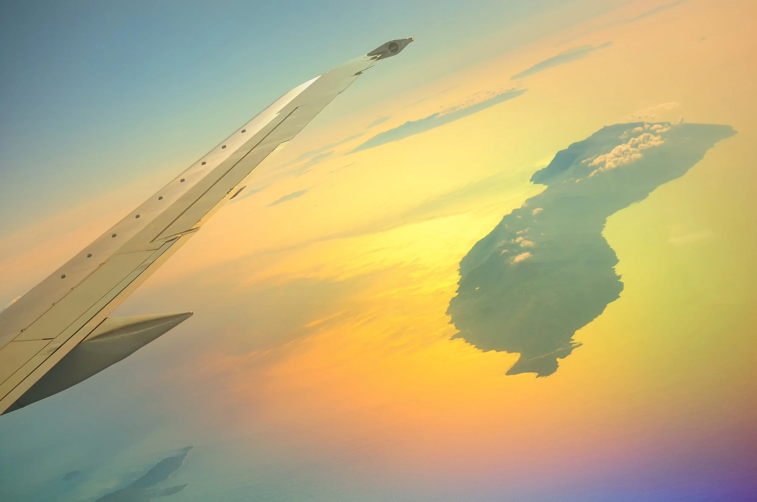 View from an airplane window showing the island of Icaria