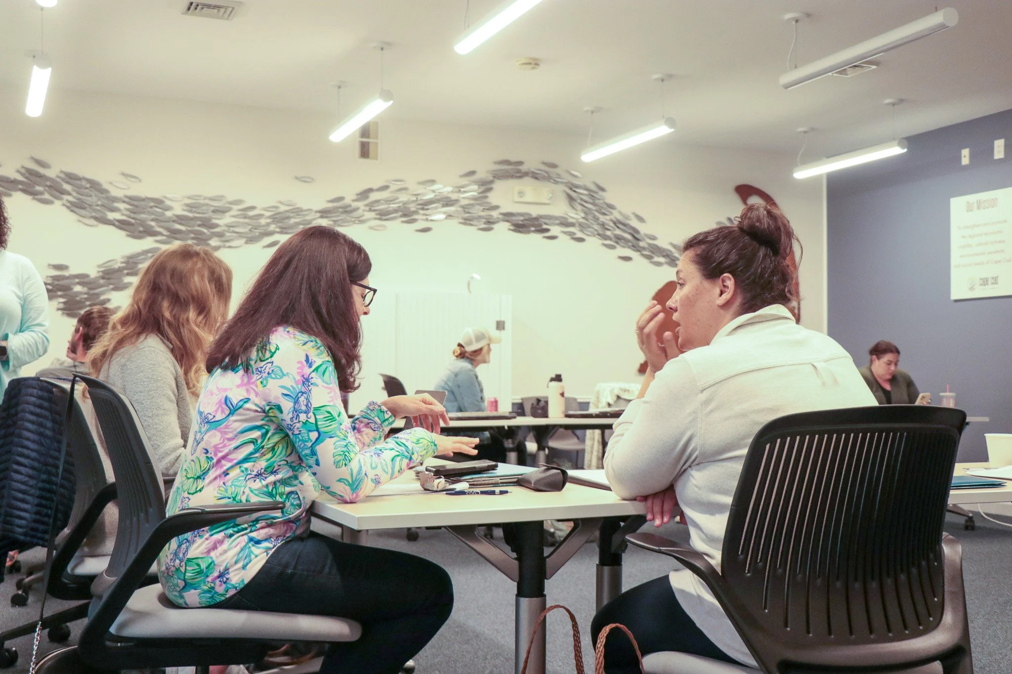 Boost Your Brand participants working at their tables during a live workshop session