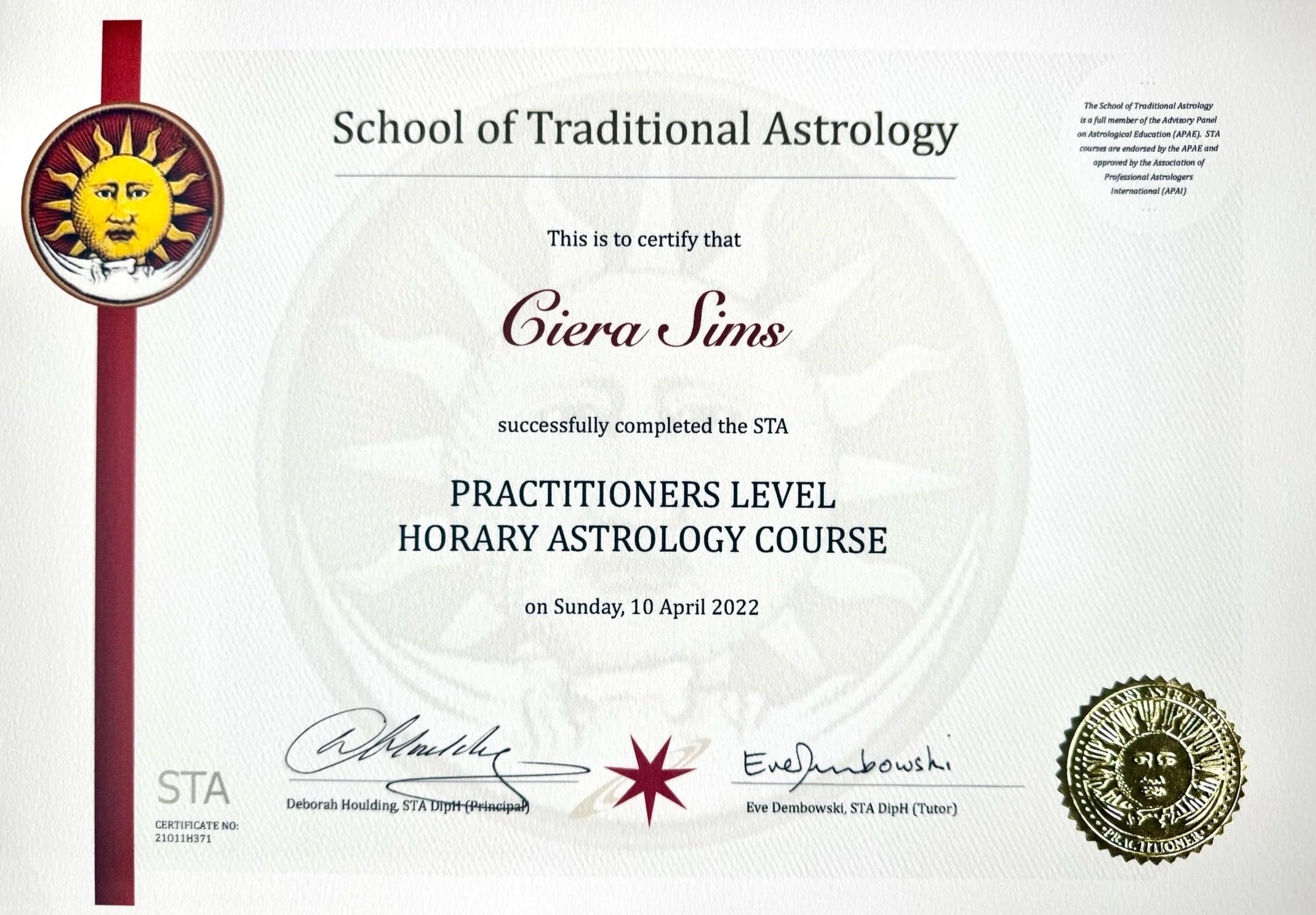 Certificate of completion from the School of Traditional Astrology awarded to Giera Sims, dated April 10, 2022, featuring signatures, official seals, and decorative elements.