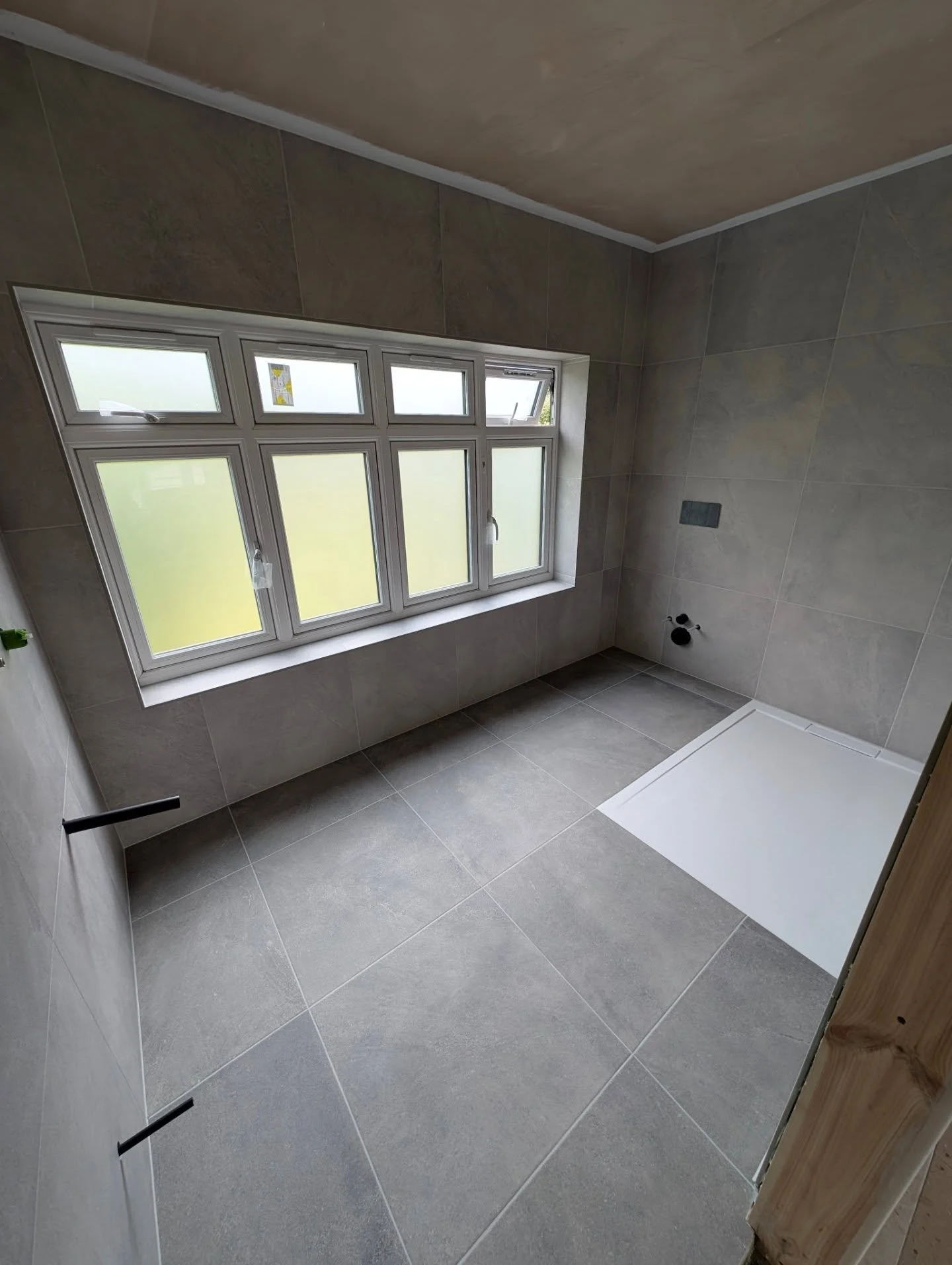 Two tone grey shower room with flush shower tray looking smart! 

#andycoldwelltiling #sheffieldtiler #sheffield #showerroom #kelmore