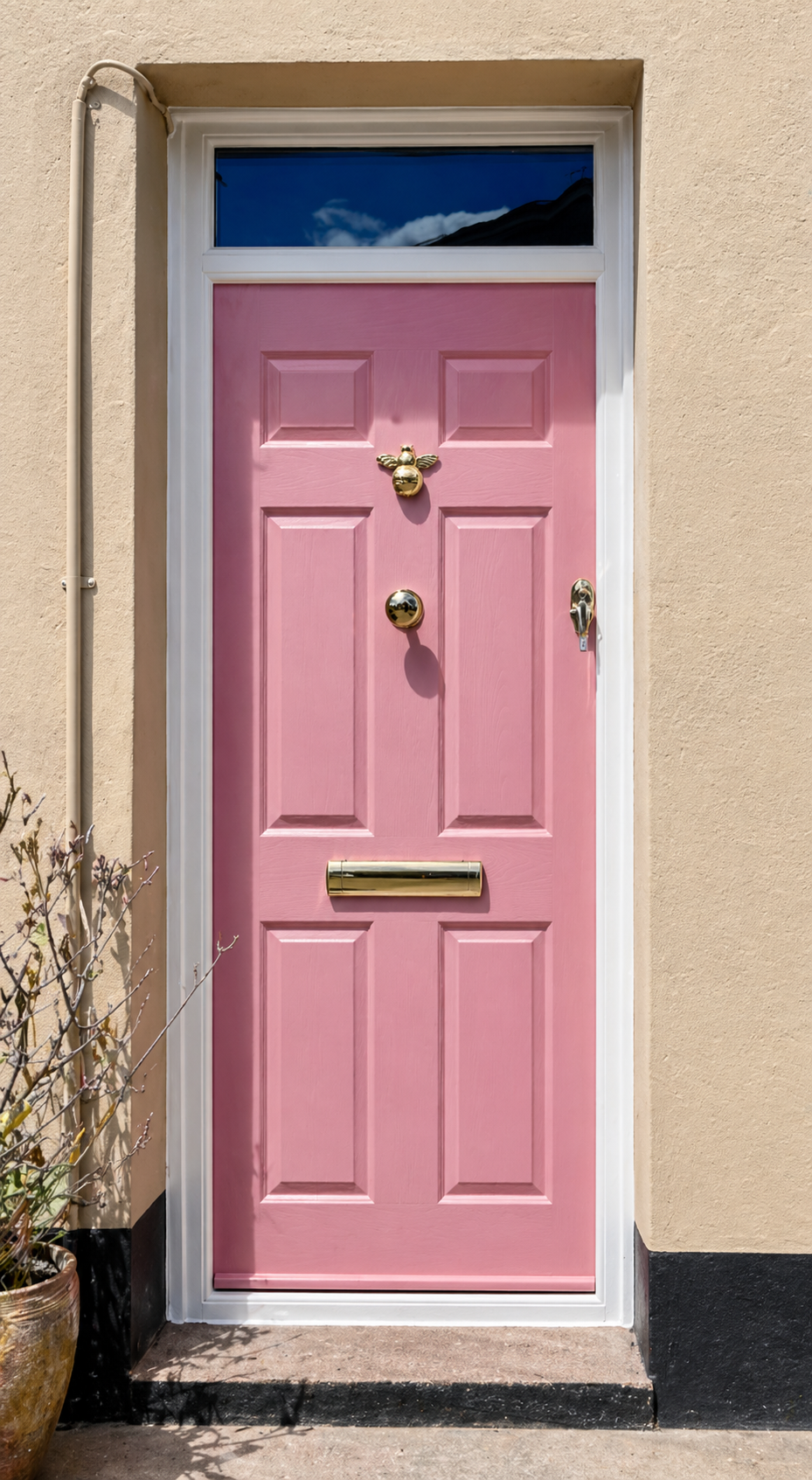 Pink Composite Door and round door handle.