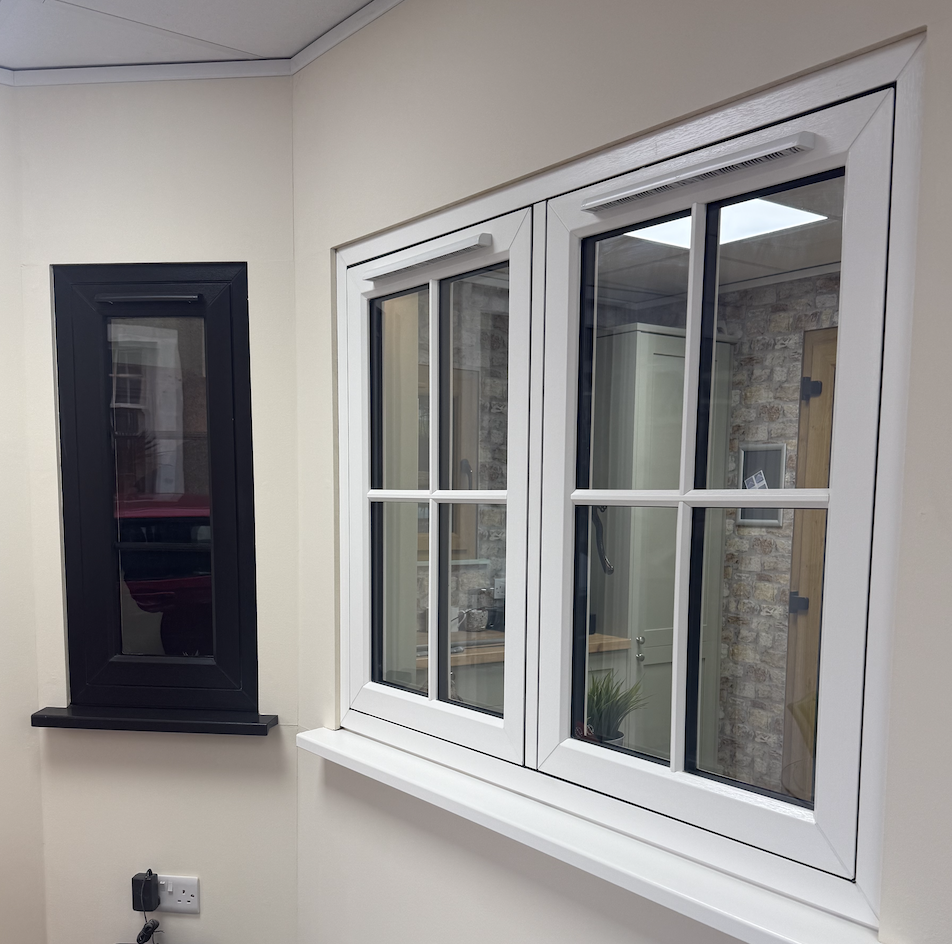 Balck and white grained Flush casement REHAU Rio windows in Budleigh