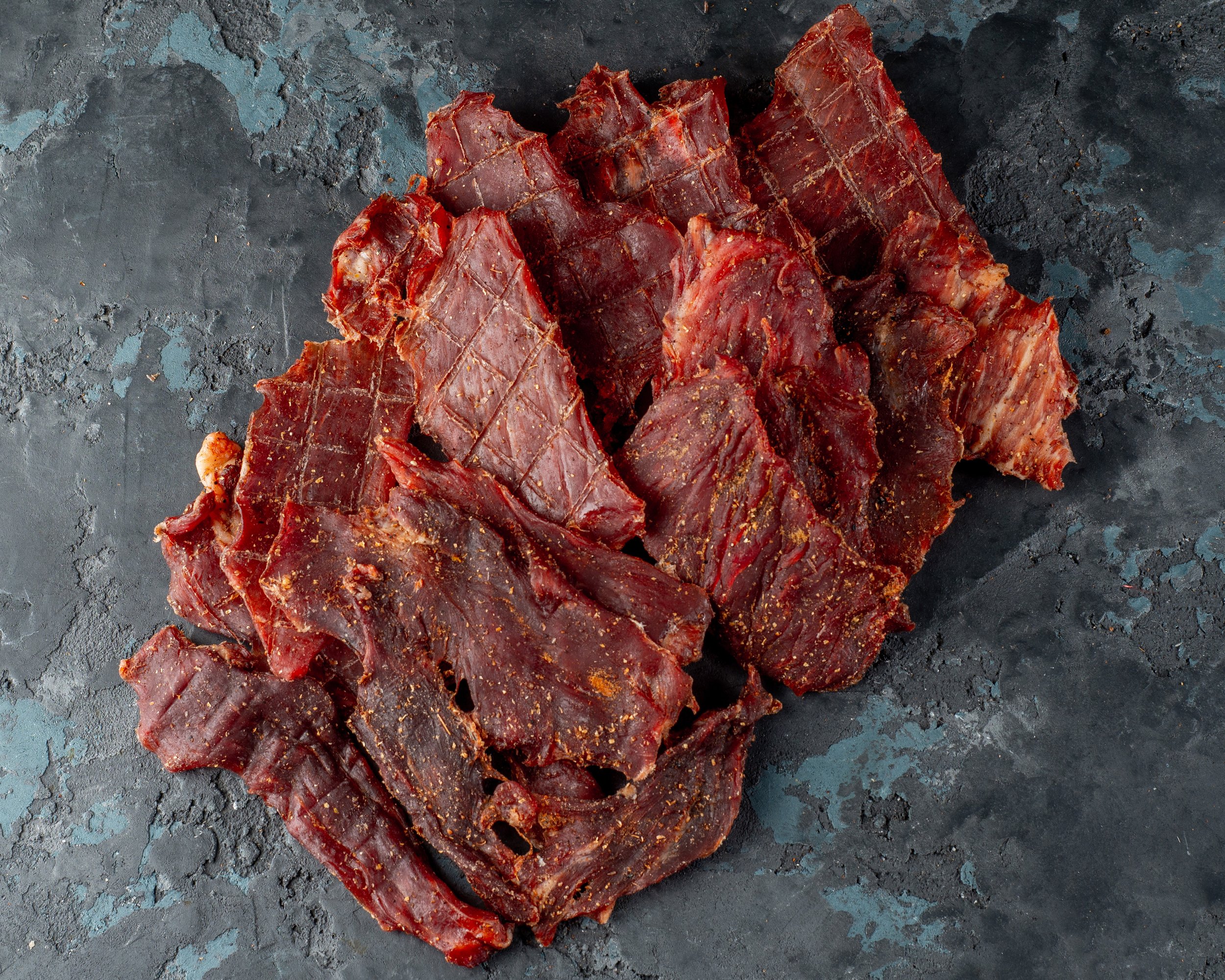 dried-jerky-pork-meat-dark-background.jpg