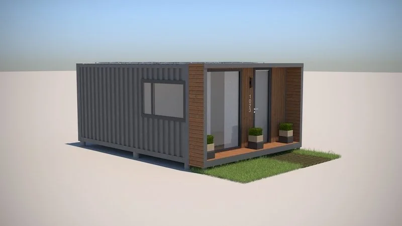 A small modern house built from a shipping container with wooden accents, a glass front door, and potted plants on a small porch, surrounded by a grassy area.