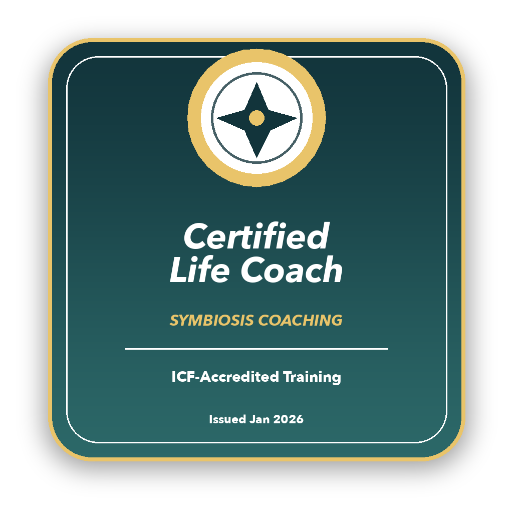 A badge with the text 'Certified Life Coach' and 'Symbiosis Coaching,' indicating ICF-Accredited Training issued in January 2026. The badge features a compass symbol at the top, set against a dark green background with gold and white accents.