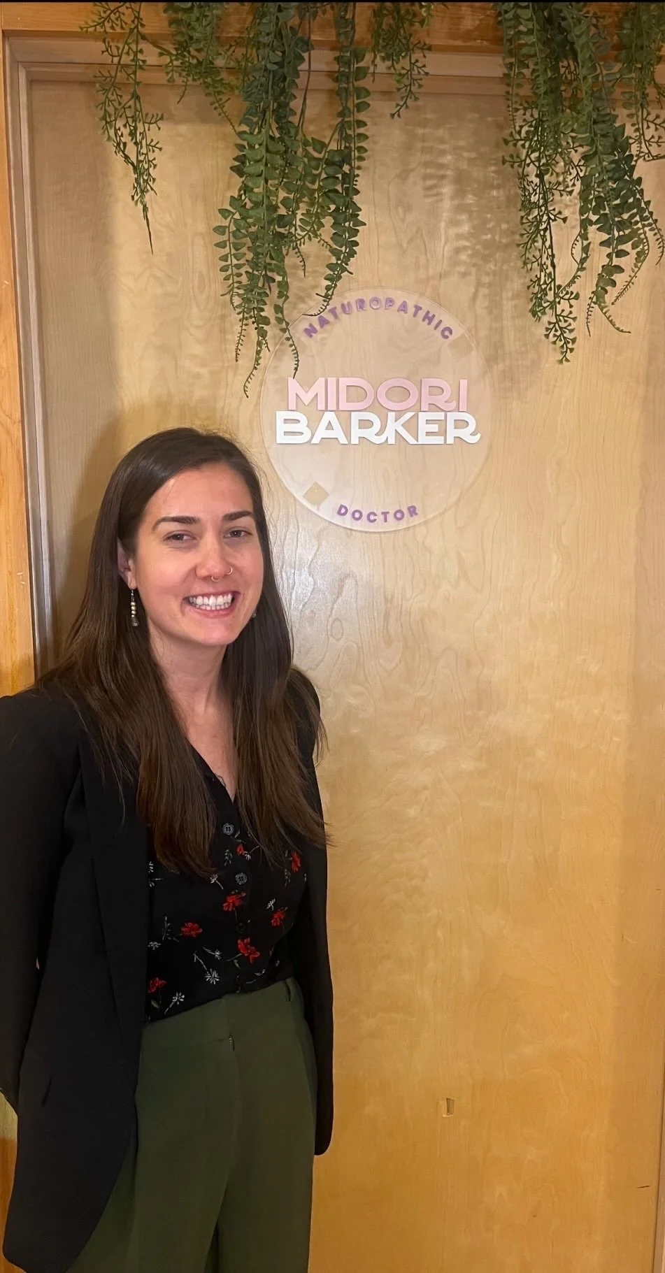 Dr Midori Barker, Naturopathic Doctor with her branded door sign, designed by Cetadora Graphic Design Studio