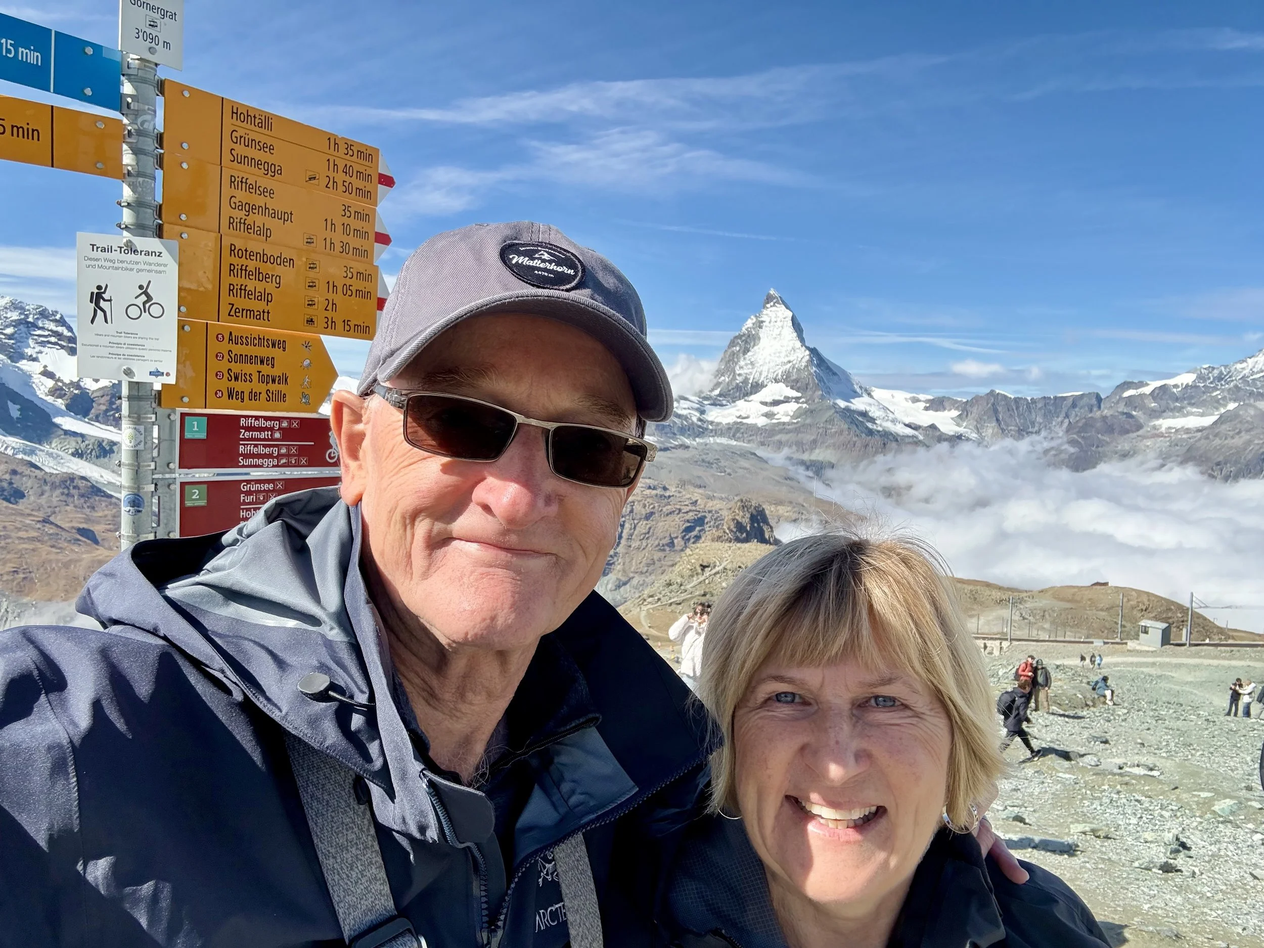 A man and woman taking a selfie at the Matterhorn.