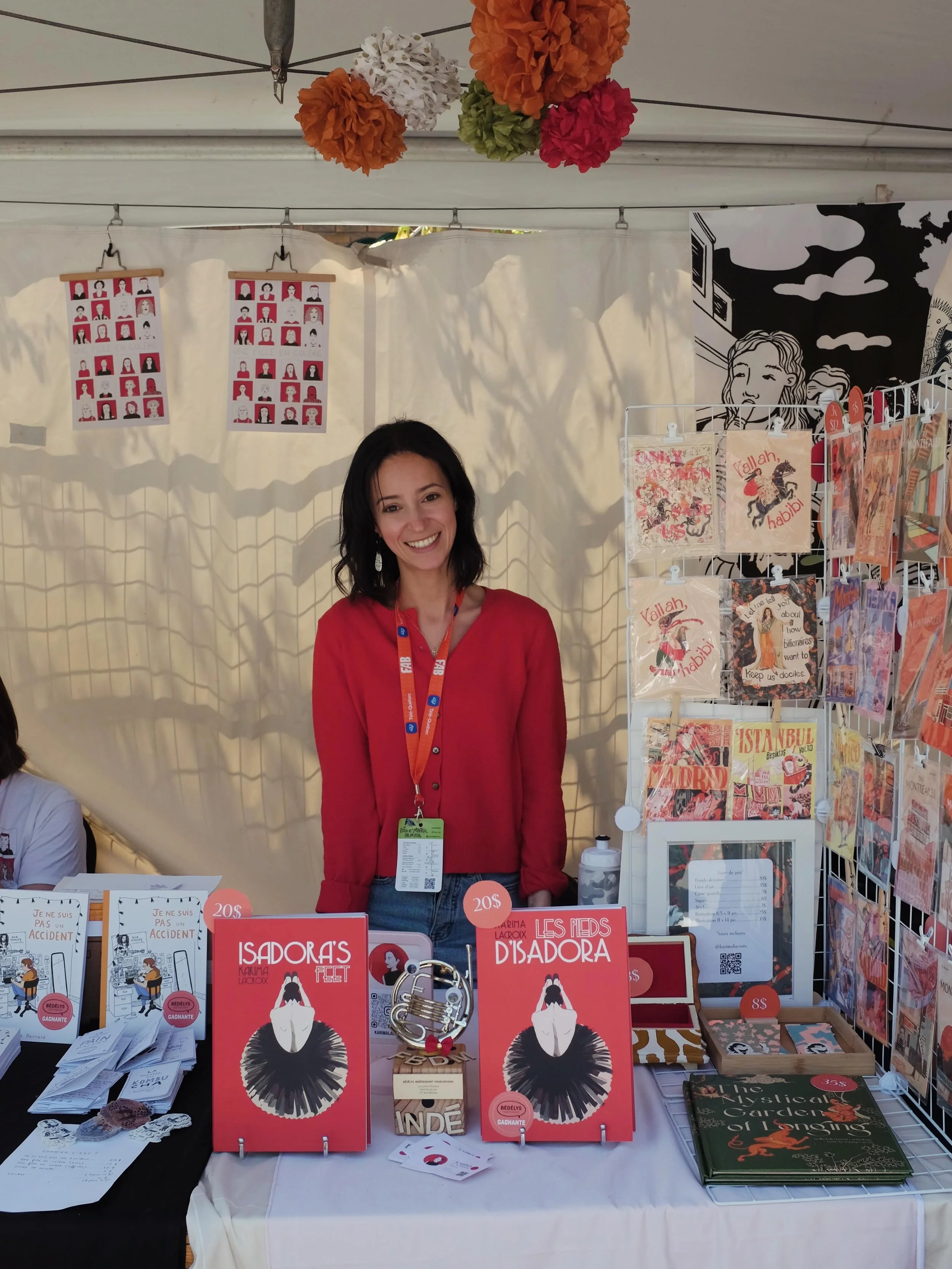 Jours 2 et 3 au @fbdm_mtl!! Venez me voir - Il me reste quelques copies de ma BD Les Pieds d&rsquo;Isadora! 🩰🧑&zwj;🩰🌸 
Merci &agrave; ma soeurette pour cette super 1ere photo ❤️❤️

#fbdmcaf2026 #montrealfestival #plateaumontroyal #ruestdenis #fbd