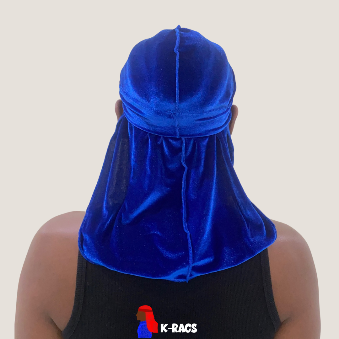 Person wearing a shiny blue durag, viewed from behind, on a gray background.