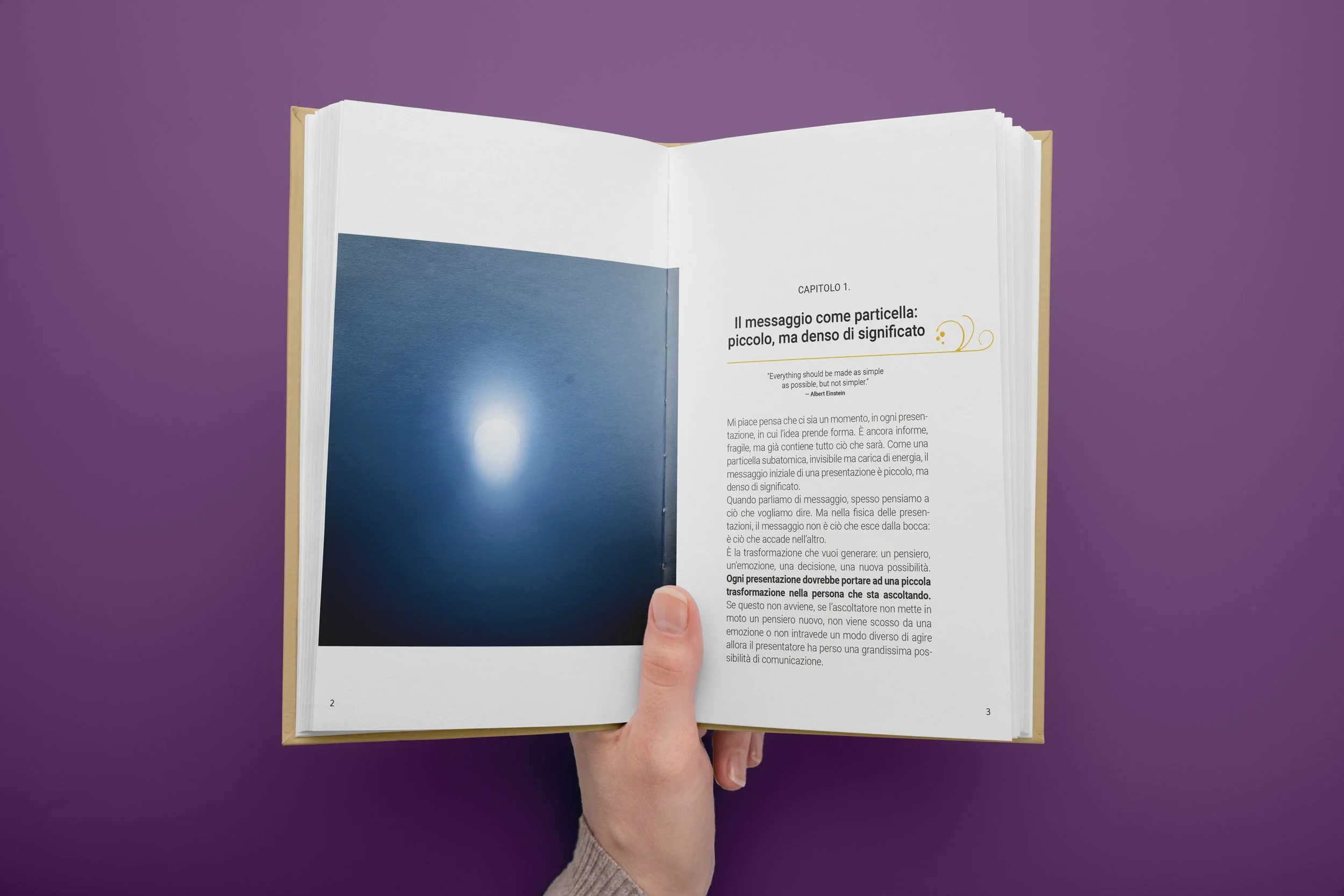 Book hold by a female hand. Inside of the book visible