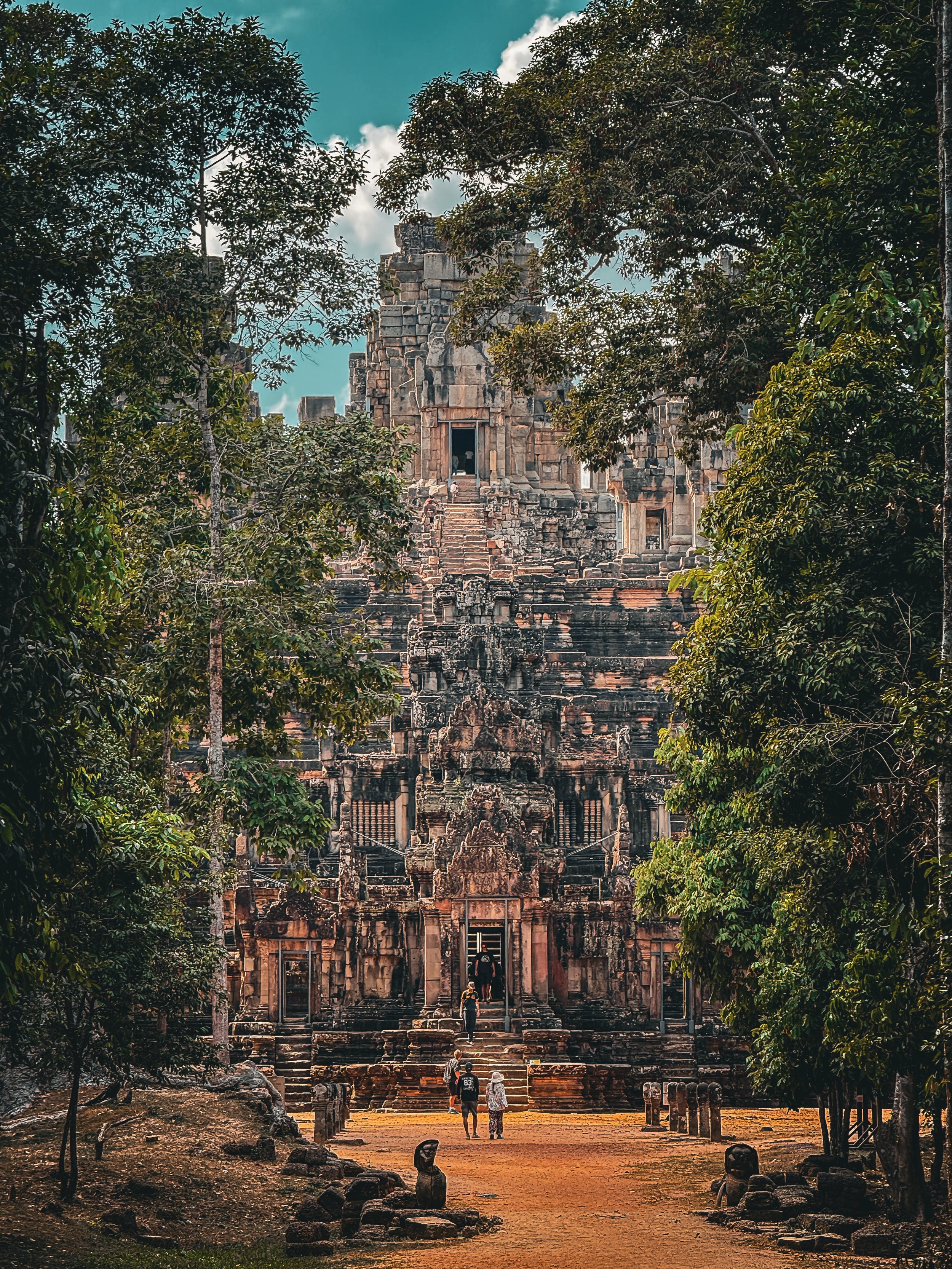 Ta Keo Temple, just a short walk or tuk tuk ride from the Tomb Raider Temple. Approaching it through the trees felt you were the first person discovering it. We got our steps in going up this one. Every stair was double height and worn down from time