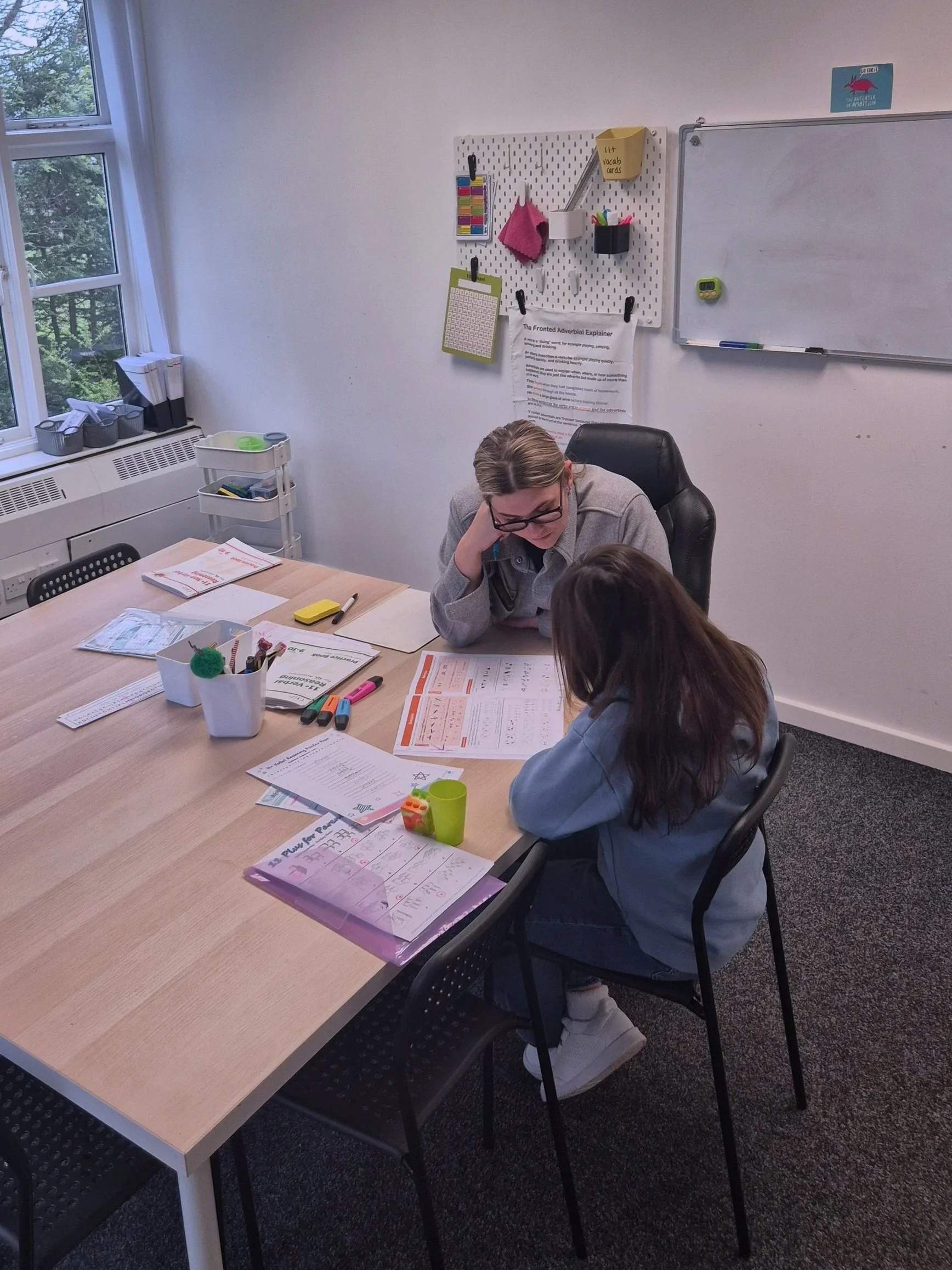 Sophie Hughes leading a tutoring session with a child at Study Space Academy in Wirral