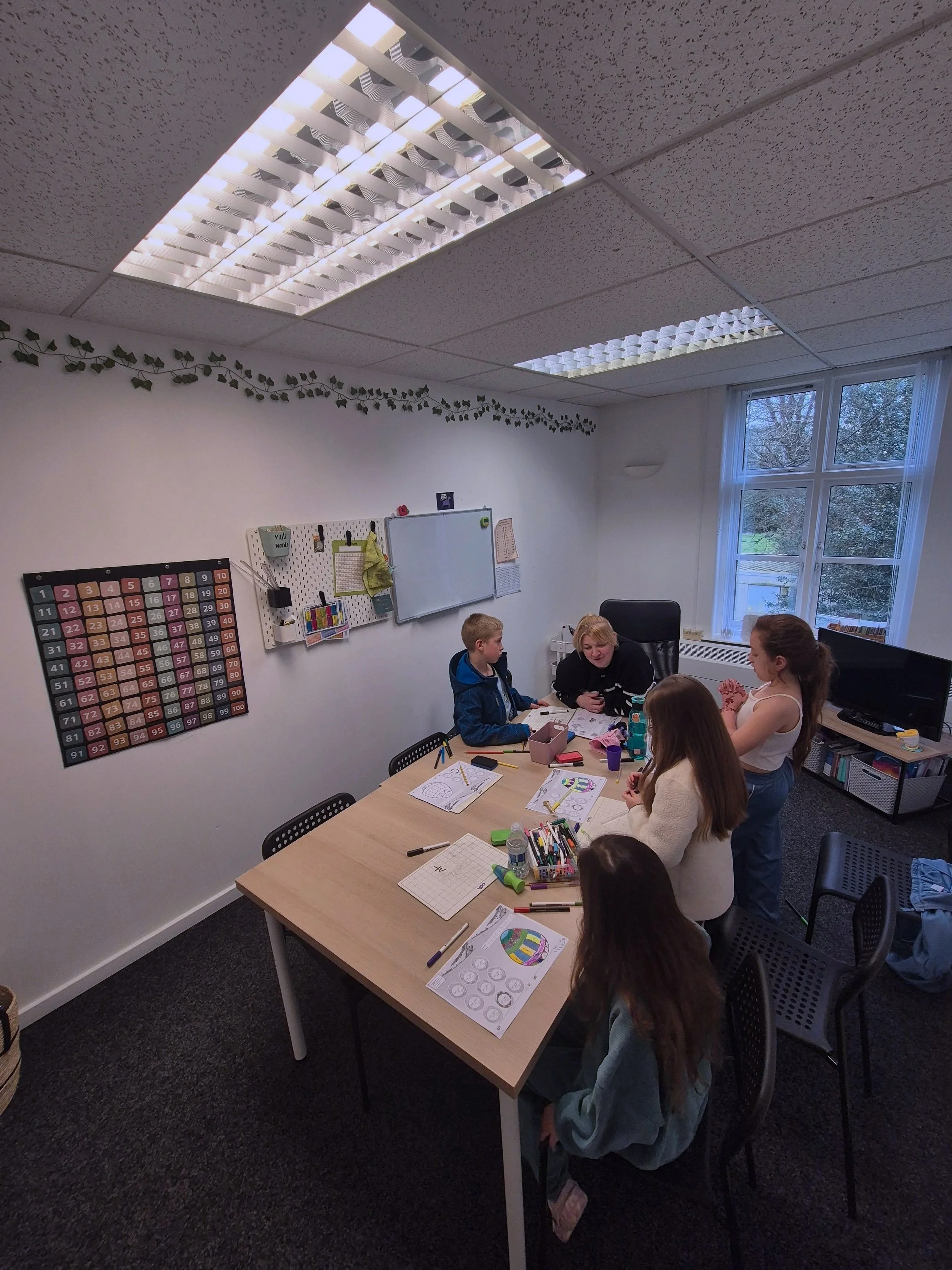 Sally McLeod supporting home educated children during a learning session at Study Space Academy