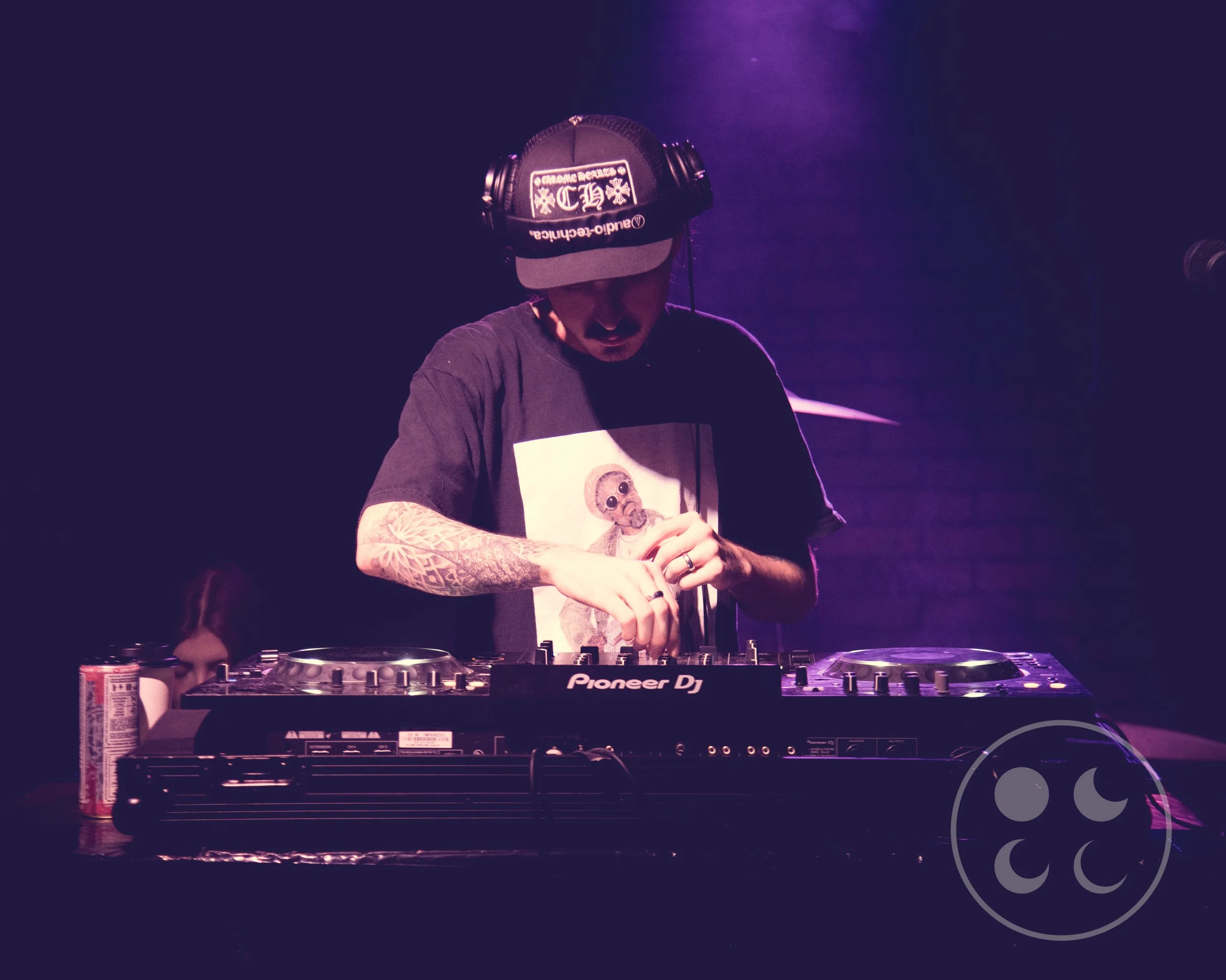 Image of a DJ mixing on his deck.