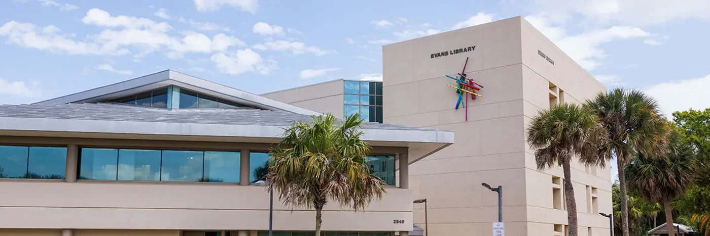 Exterior of Evans Library at Florida Tech with the library name visible above the entrance.