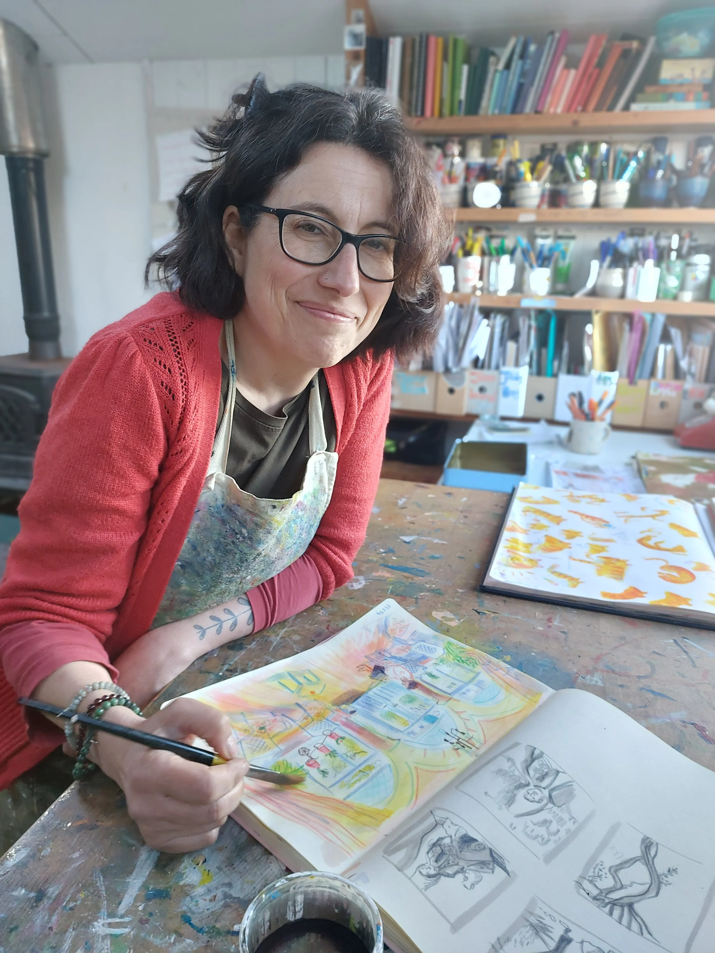 Martha Lightfoot drawing at desk in studio