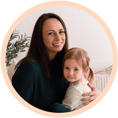 Catriona a potty training consultant holding a smiling child.