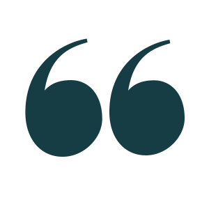 A large open quotation mark icon in dark turquoise color.