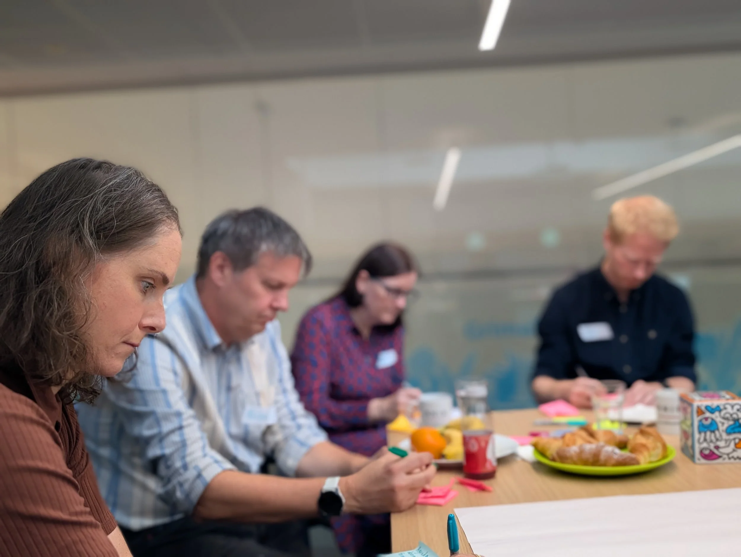 Four senior charity leaders considering how best to tackle workslop in our organisations