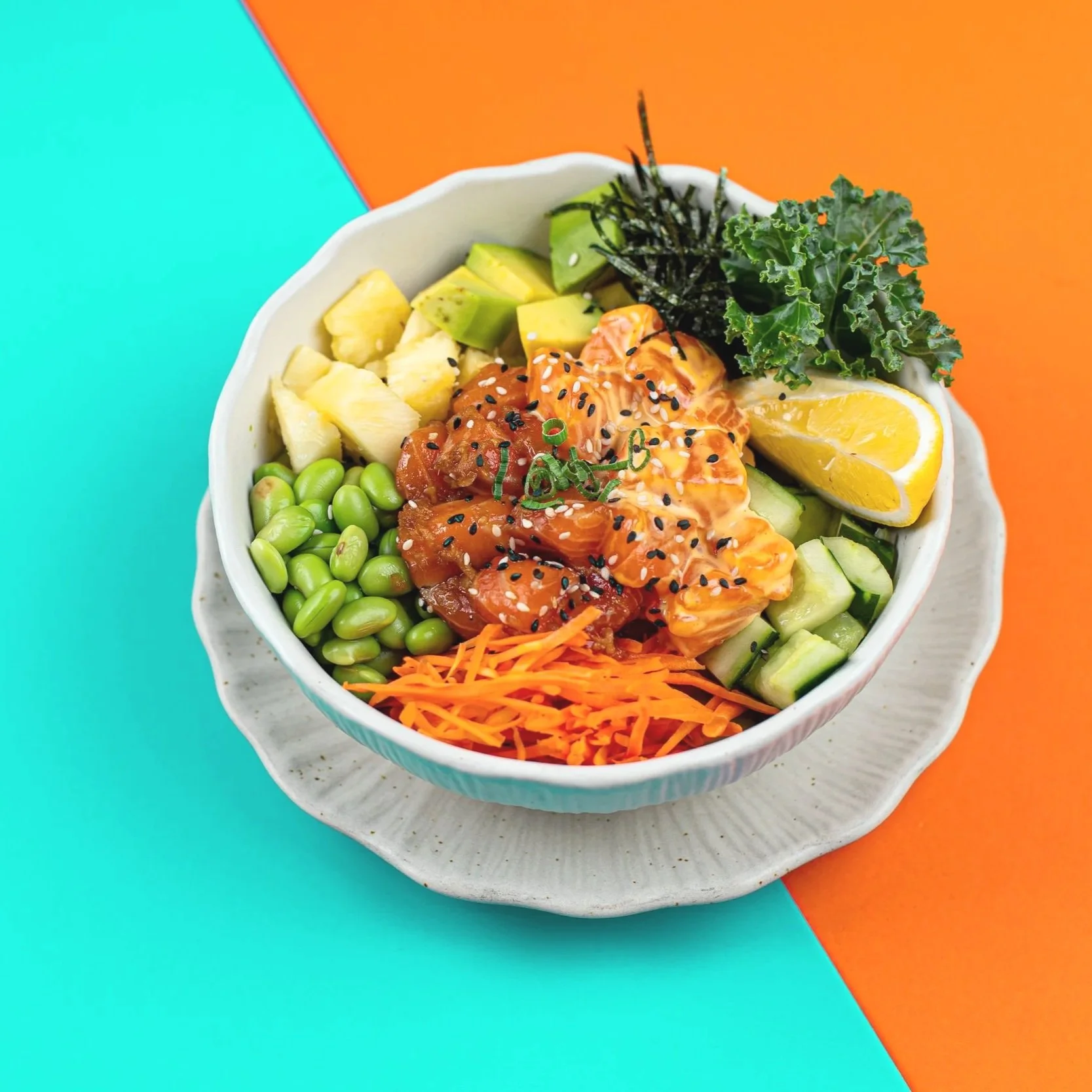 Our premium grade salmon sashimi poke bowls with housemade sauces