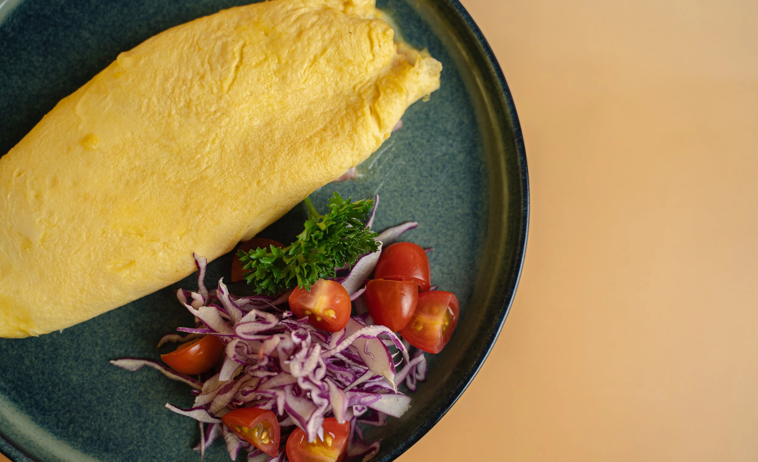 Our new breakfast by the bowl spot. Classic omelet with bacon and cheese, a must with your coffee