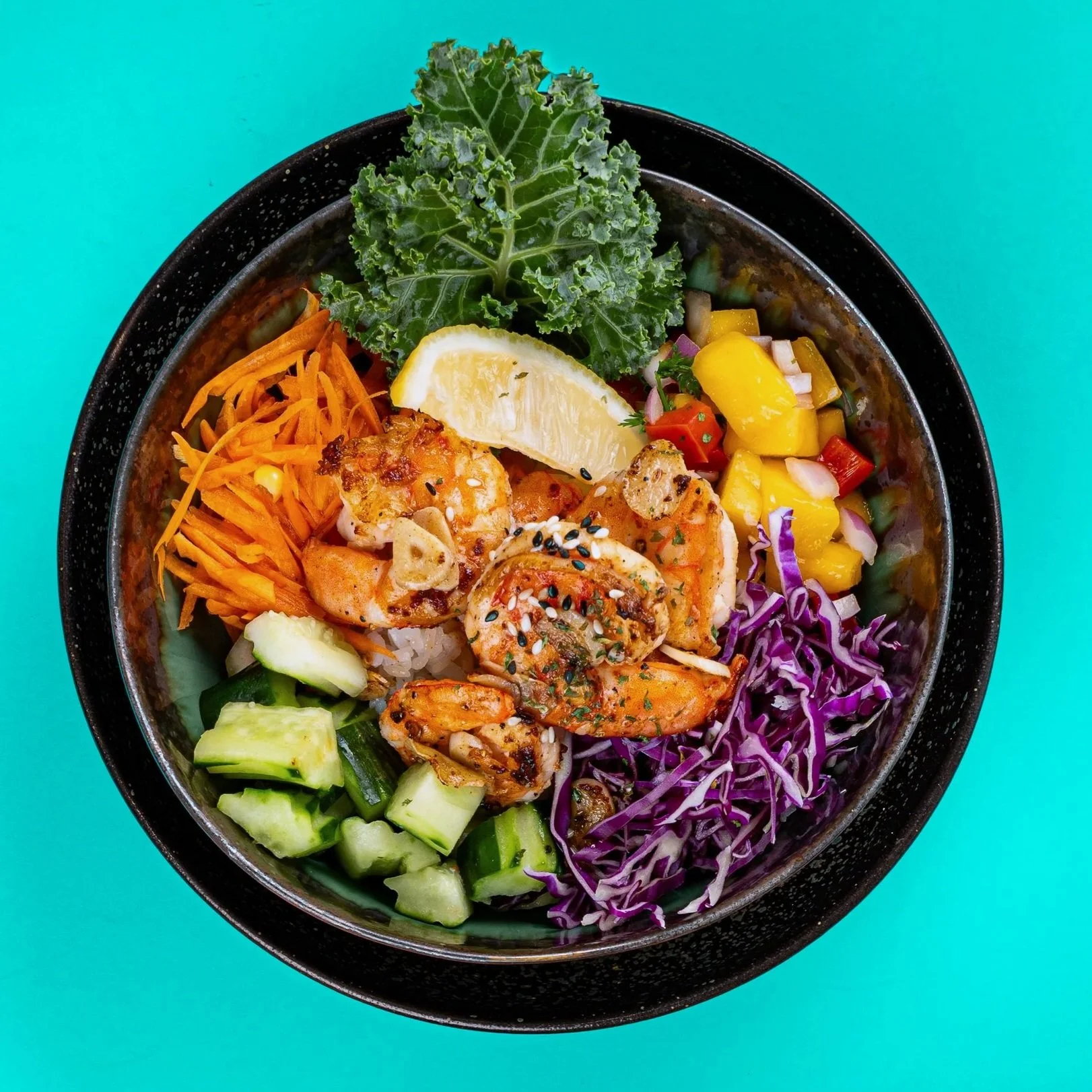 Garlic Shrimp poke bowl with fresh mango salsa, house mago chili aioli