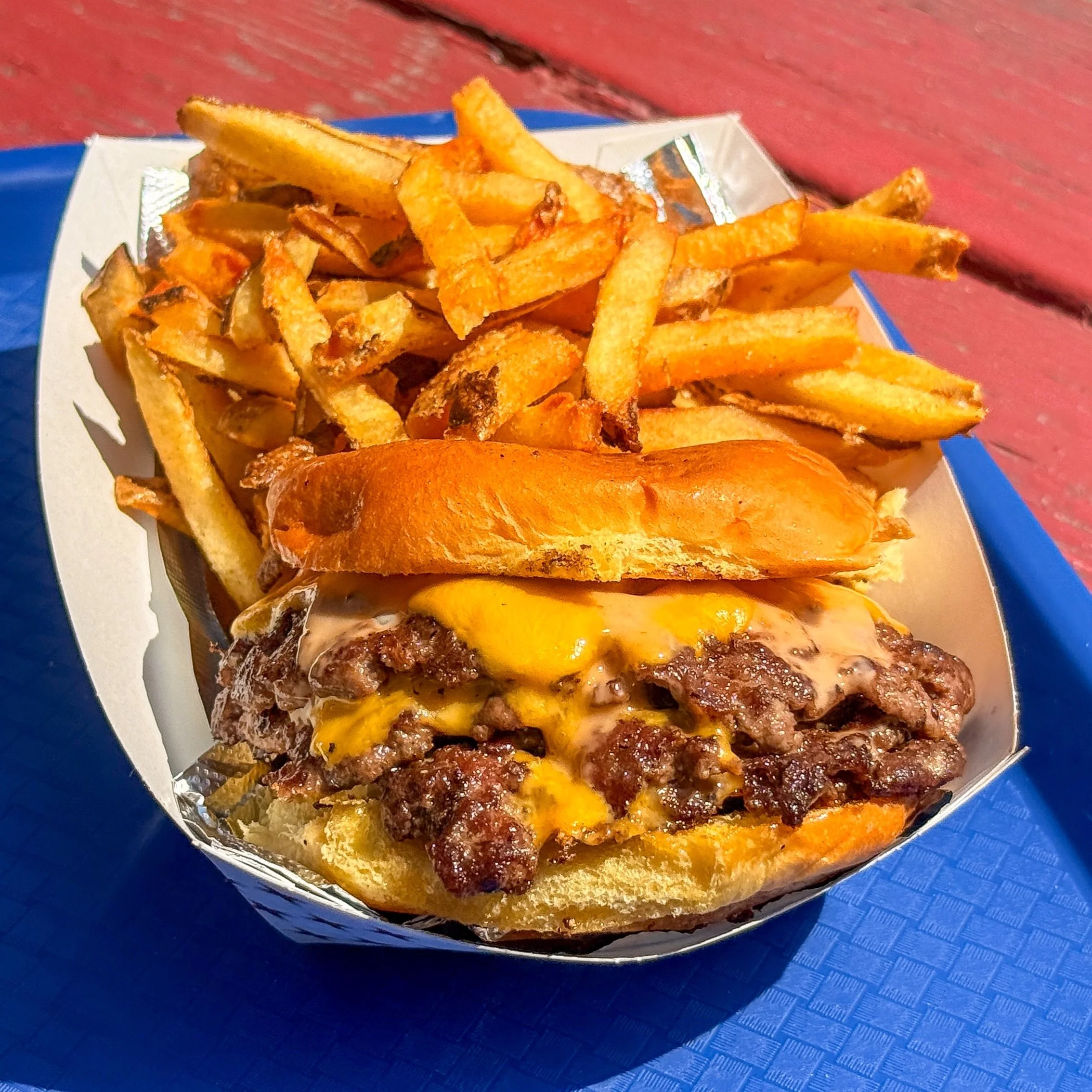 QUAD SMASH BURGER 💥 Only at Gondolas Snack Bar! 

That&rsquo;s 4 smashed patties 100% black angus beef, each with a slice of American cheese, topped with a drizzle of Gondolas Sauce 🔥

Enjoyed with hand cut fries and a milkshake!!! Wooooo what a me