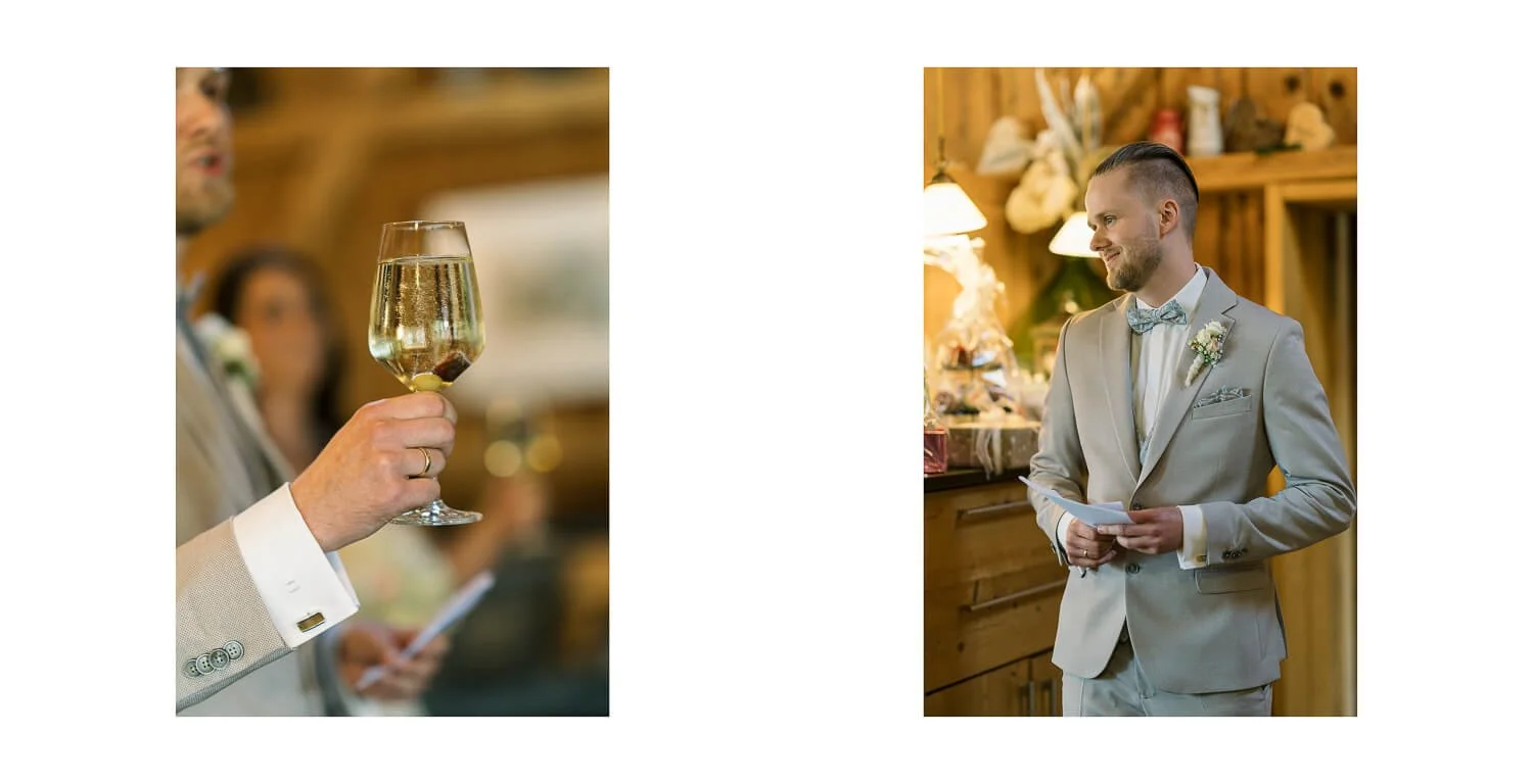 Der Bräutigam hält während der Hochzeitsfeier in der Location Hubertus Apfeltrang eine Rede, während Gäste mit einem Glas Sekt anstoßen