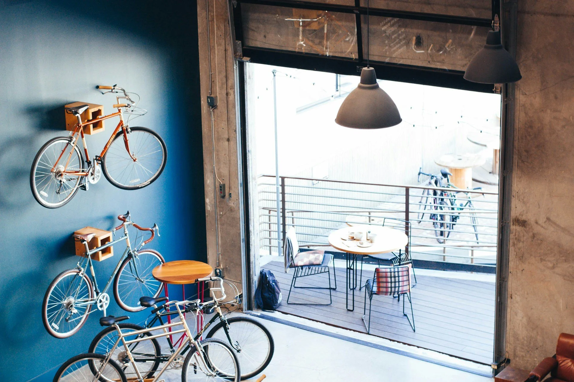 Stand out and sell more image of bicycles hanging on cafe wall