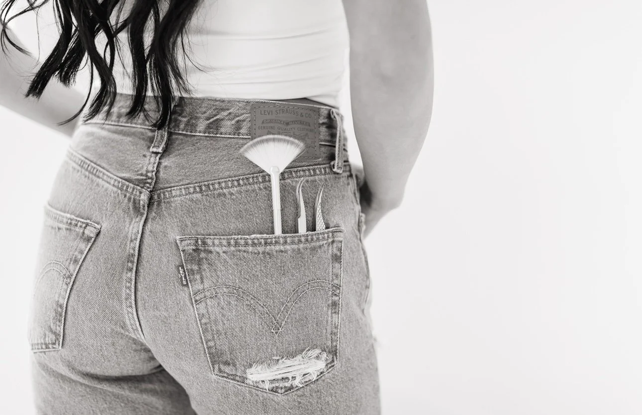 Close-up of professional esthetician tools including a fan brush and skincare applicators, representing customized facial treatments, chemical peels, dermaplaning services, and advanced skincare techniques offered at Twin B Beauty Co in Canyon TX.