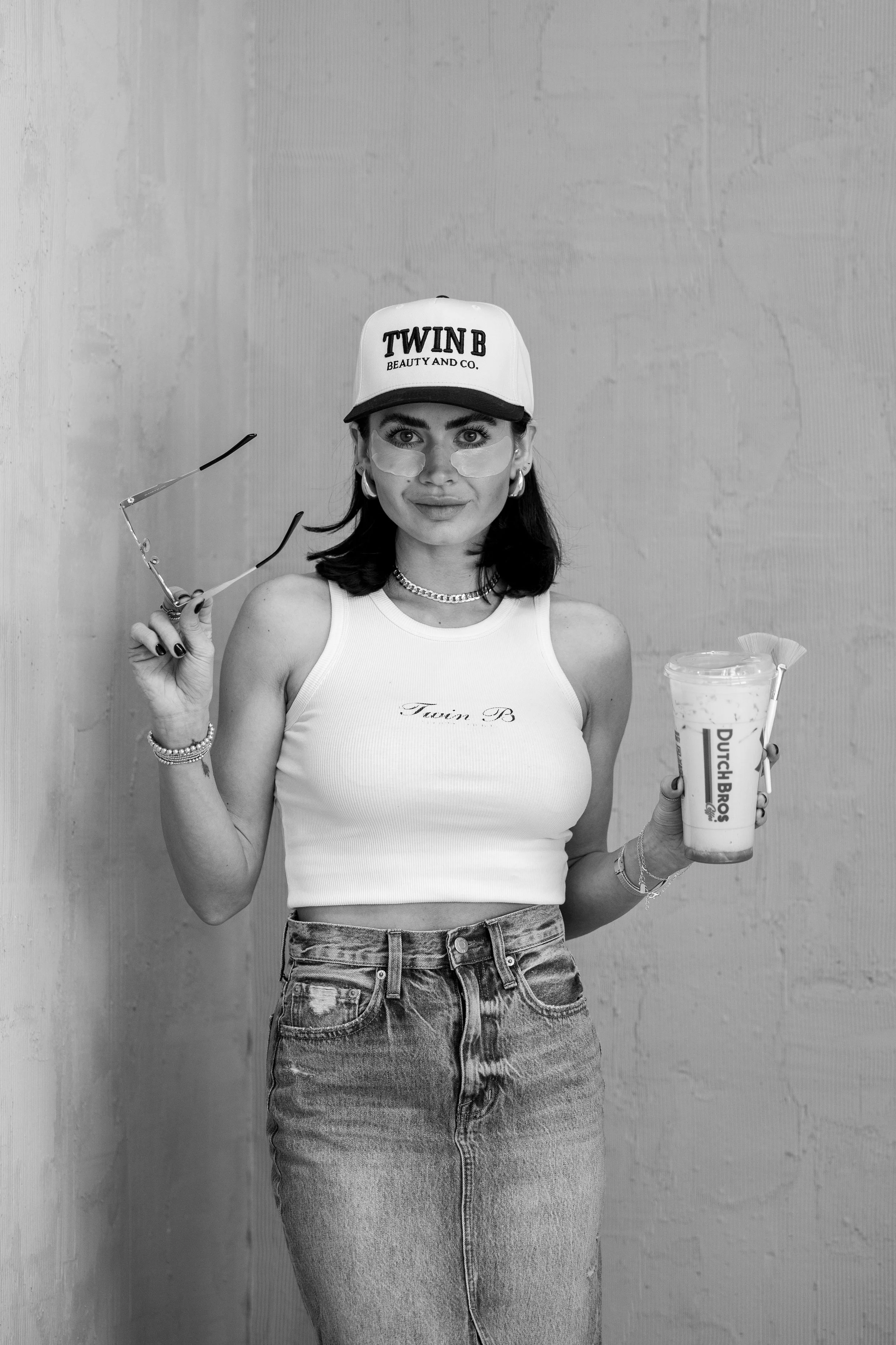 Licensed esthetician and owner of Twin B Beauty Co in Canyon Texas, standing outside her beauty studio, representing professional skincare services including facials, lash extensions, brow services, and advanced skin treatments in the Texas Panhandle