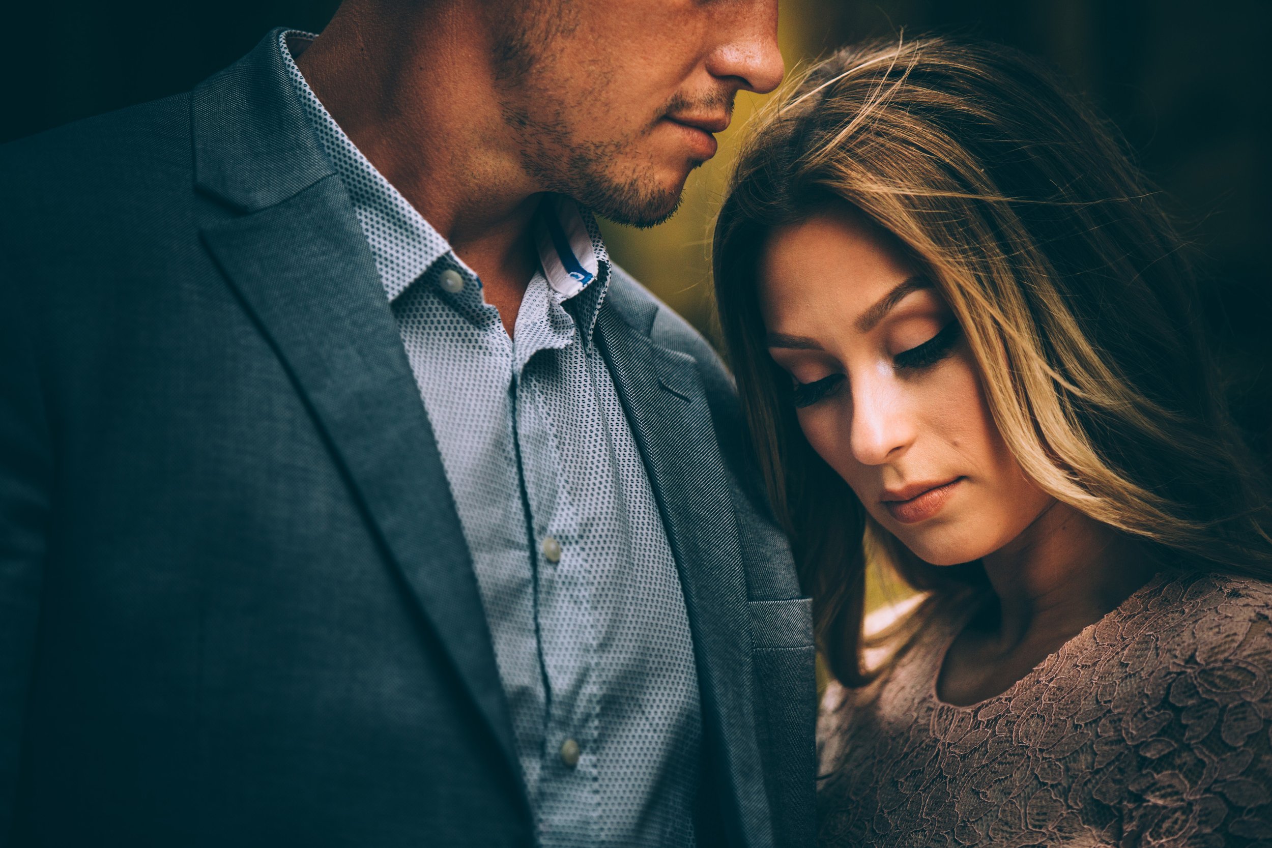 A close-up shot of a couple sharing an intimate, emotional moment during their engagement session.