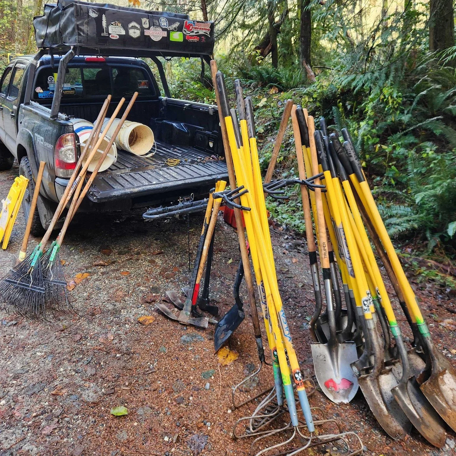 Last Sunday at Sprockids the clouds moved aside just for an intrepid group of trail warriors of all ages to gather their tools an spread out across the trails, raking them smooth, draining the puddles, and reshaping berms and holes with fresh dirt.

