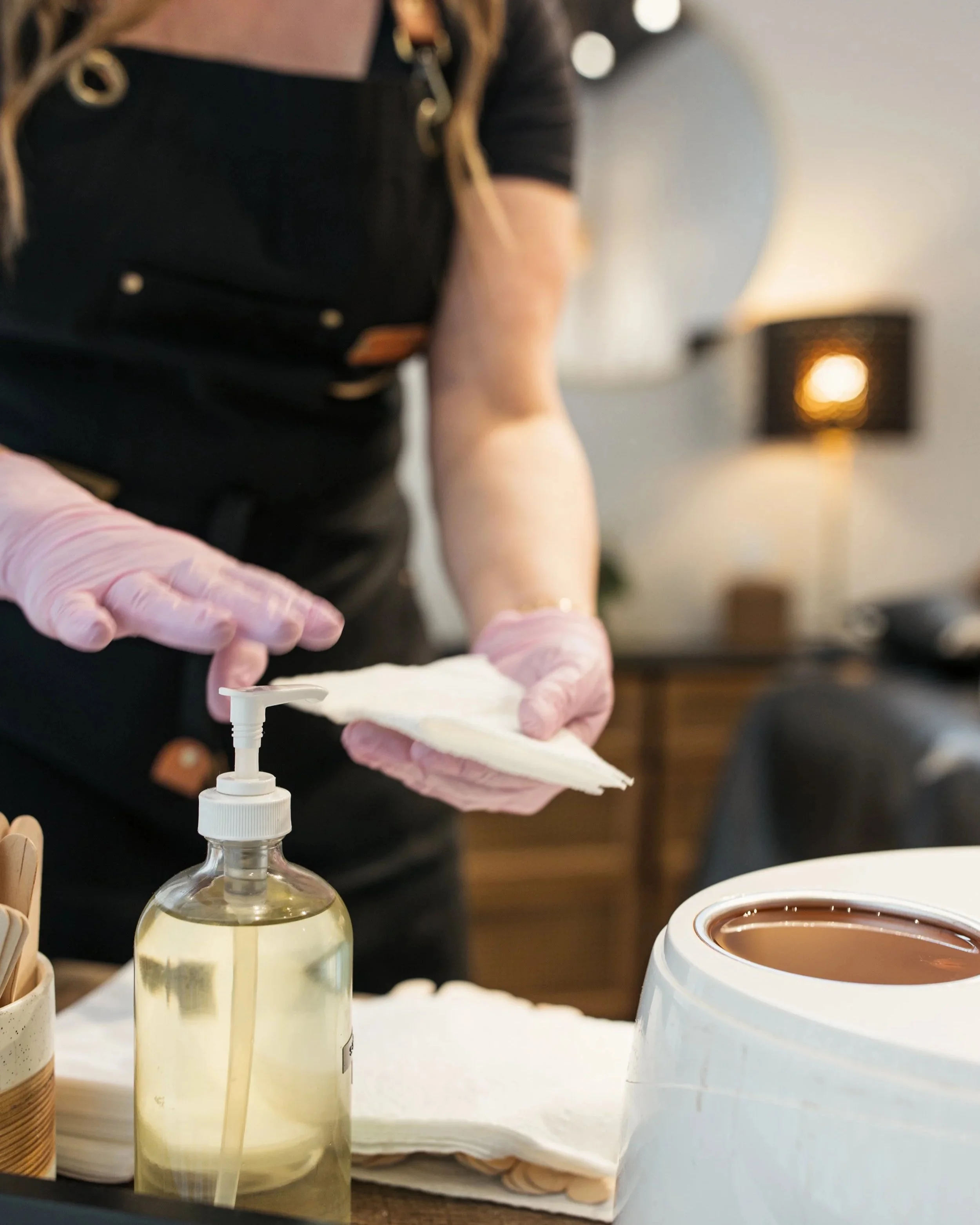 Denver esthetician preparing for a soft wax hair removal service