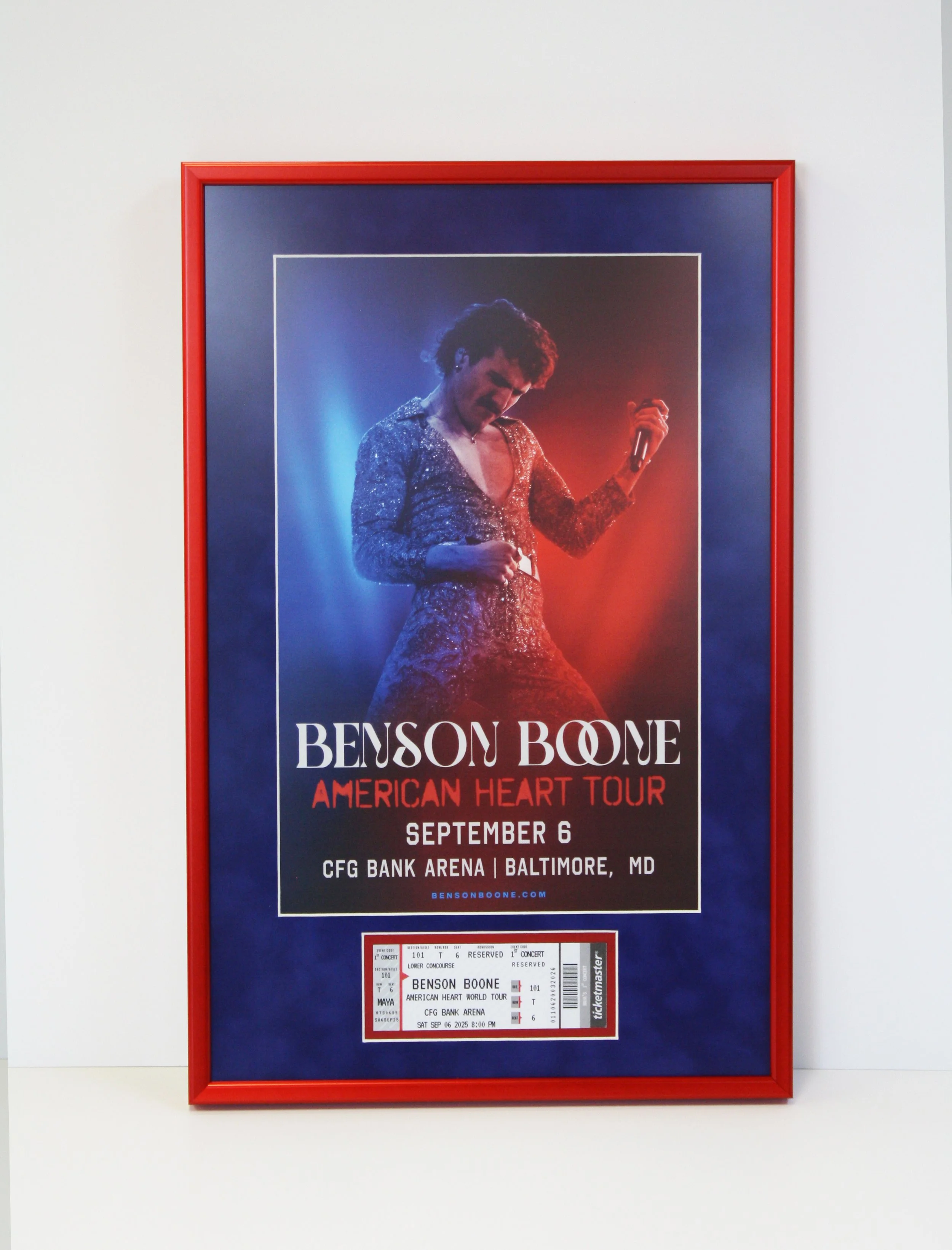 Framed poster of a concert featuring Benson Boone for the American Heart Tour on September 6 at CFG Bank Arena in Baltimore, Maryland. The poster includes a photo of Benson Boone singing, with eager ticket stubs below. Custom framed shadowbox.