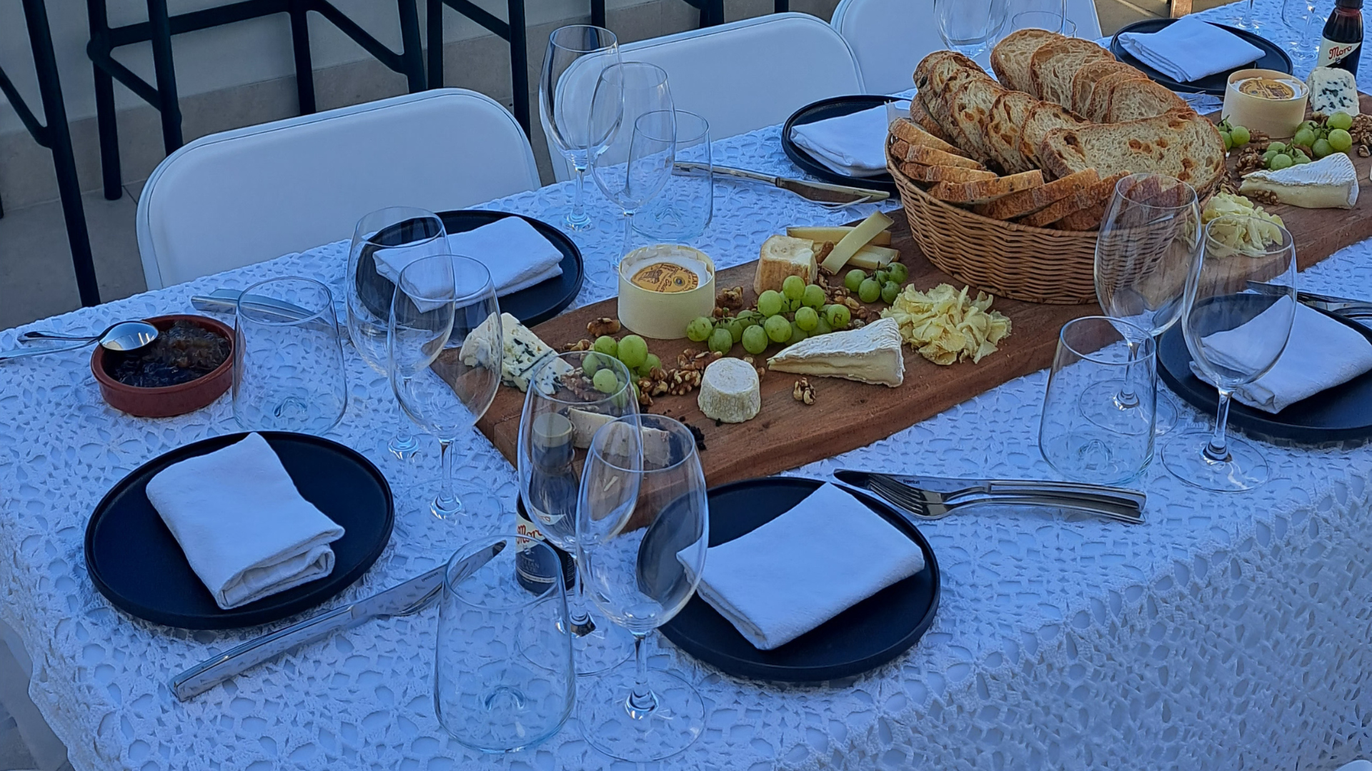 Wine glasses, cheese board, and tasting setup for a private wine and cheese event