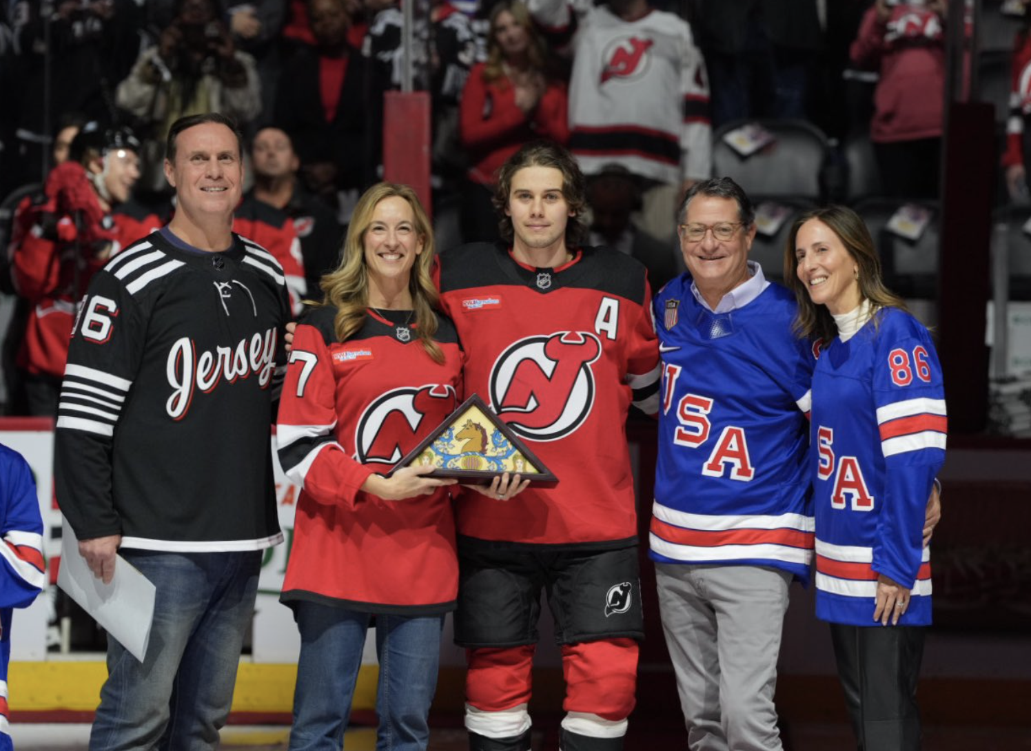 BIG BOOS: Liberal governor booed by crowd while honoring Olympic hockey star