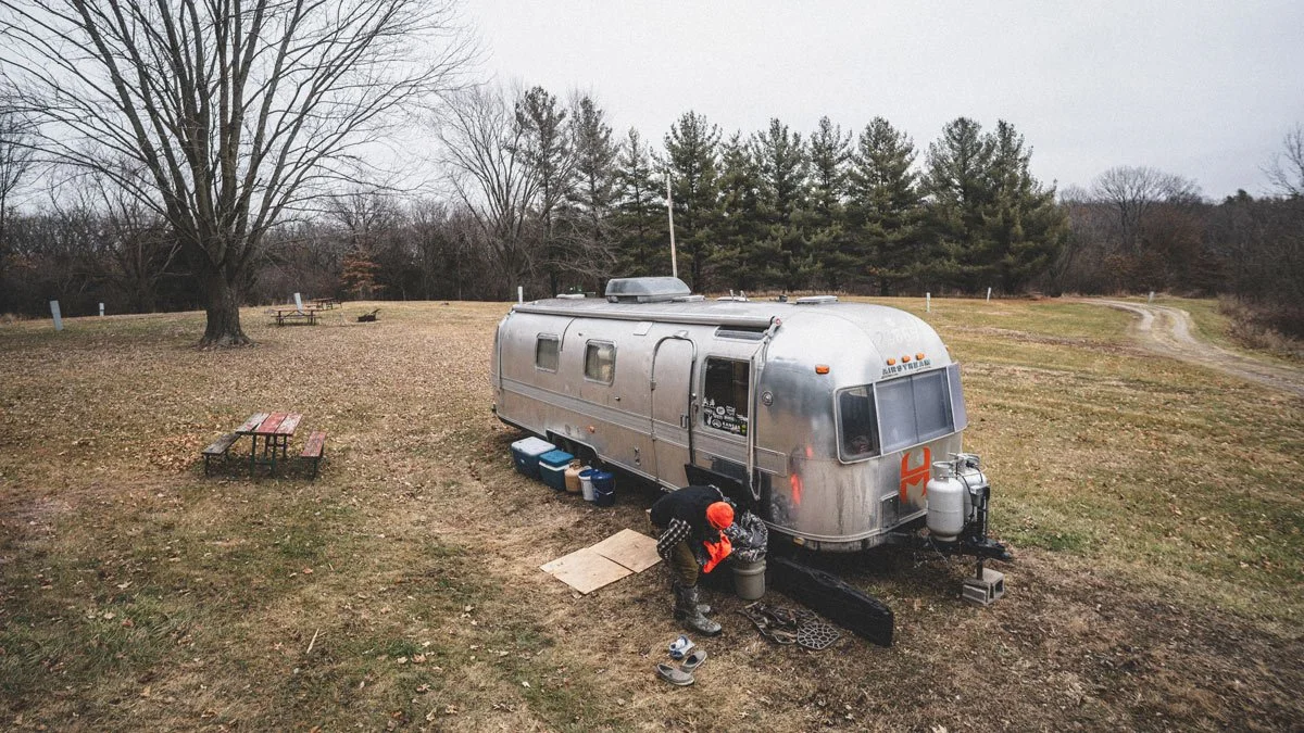 An Airstream Excella camper being used as hunting camp in southeast Iowa.